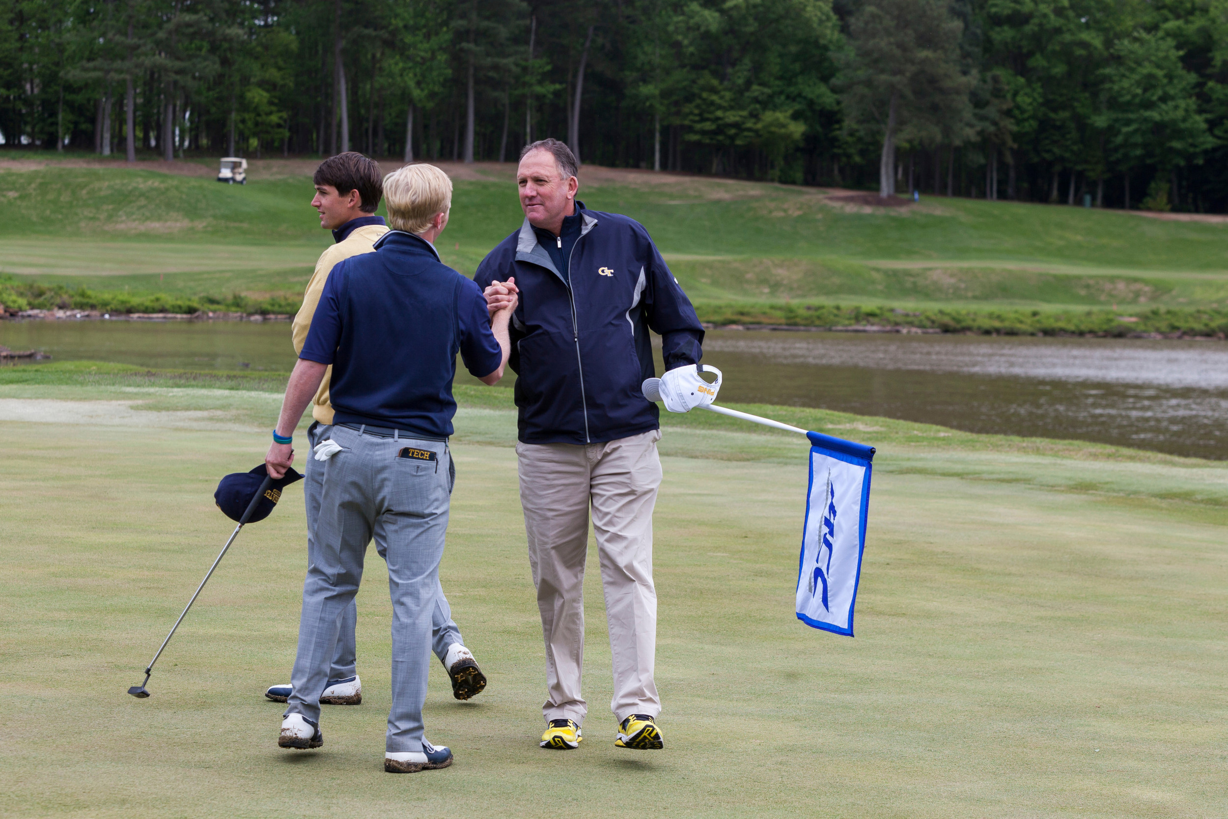 Anders Albertson is congratulated by head coach Bruce Heppler following the playoff during the final round of the ACC Golf Championship, April 26, 2015, Old North State Club, New London, N.C.