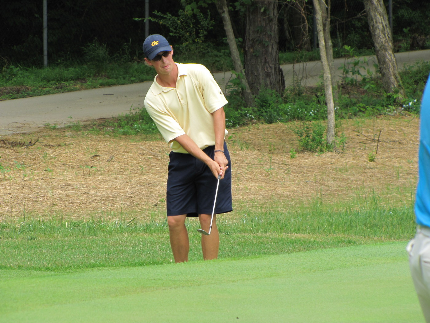 John-Tyler Griffin hits a greenside chip during Tech's quarterfinal match with Augusta State in the NCAA Golf Championship.