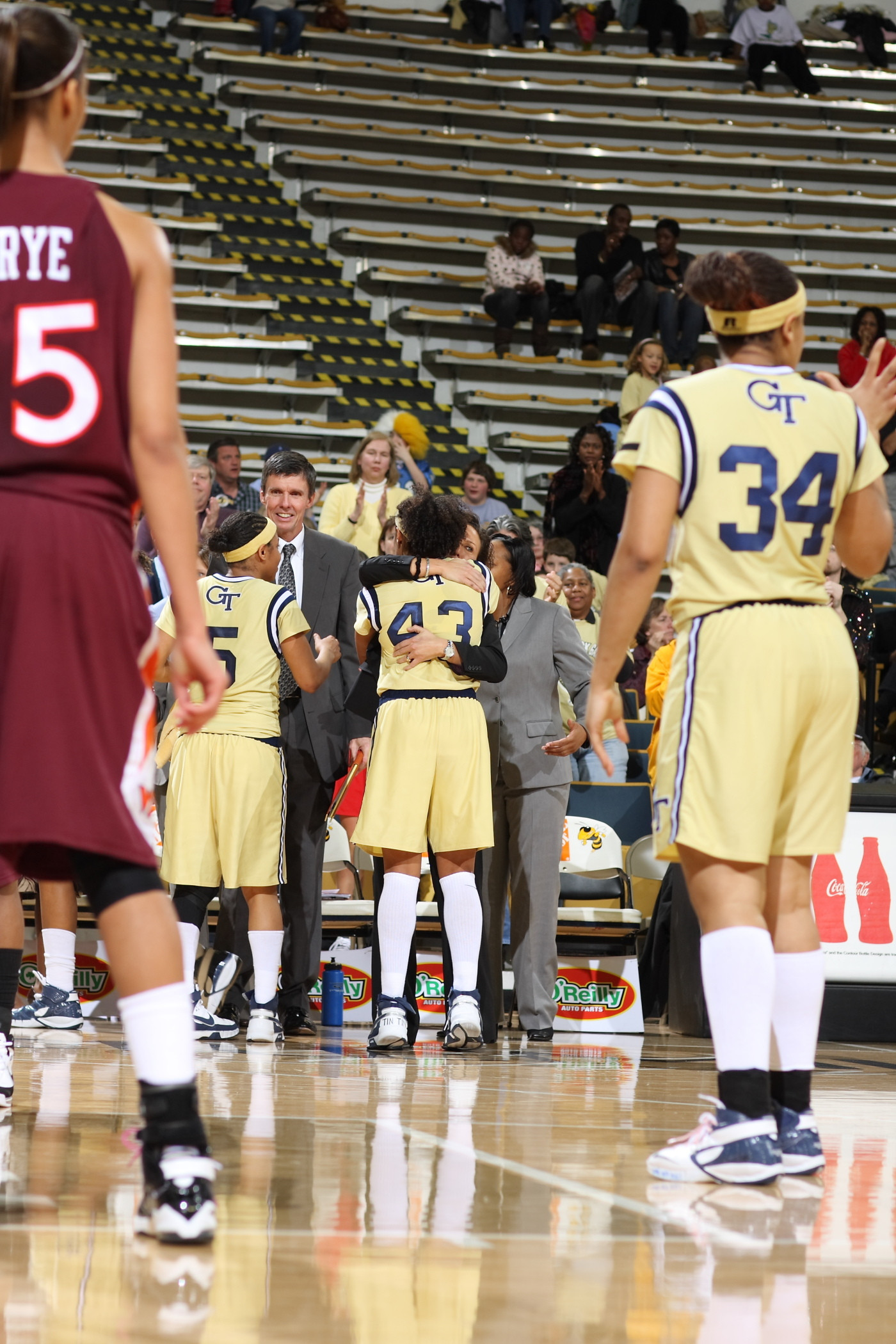 Coach Joseph embraces Chioma Nnamaka when she leaves the court during her last home game