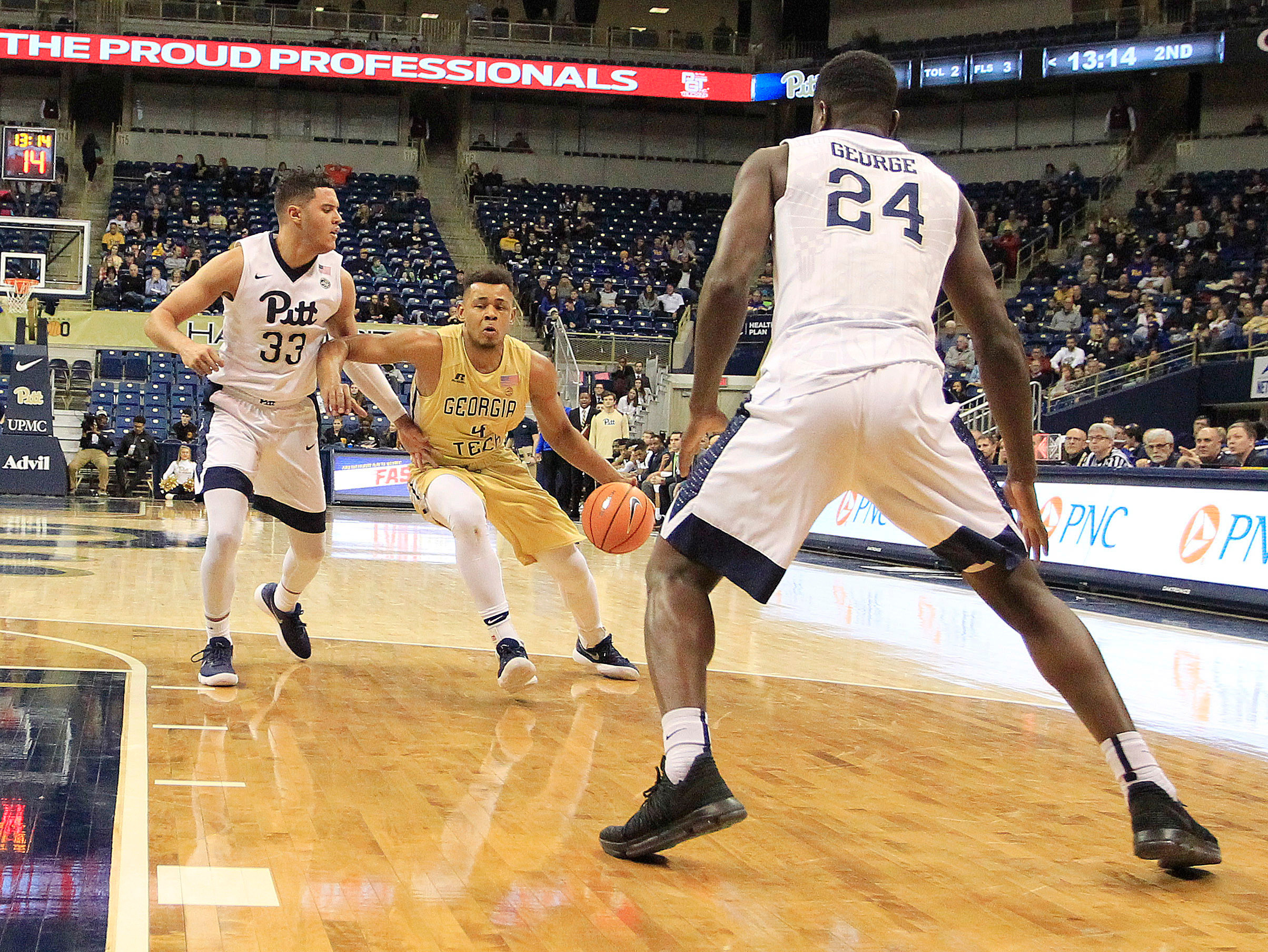 Jan 13, 2018; Pittsburgh, PA, USA; Georgia Tech Yellow Jackets guard Brandon Alston (4) dribbles the ball against Pittsburgh Panthers guard Monty Boykins (33) and forward Samson George (24) during the second half at the Petersen Events Center. The Yellow Jackets won 69-54. Mandatory Credit: Charles LeClaire-USA TODAY Sports
