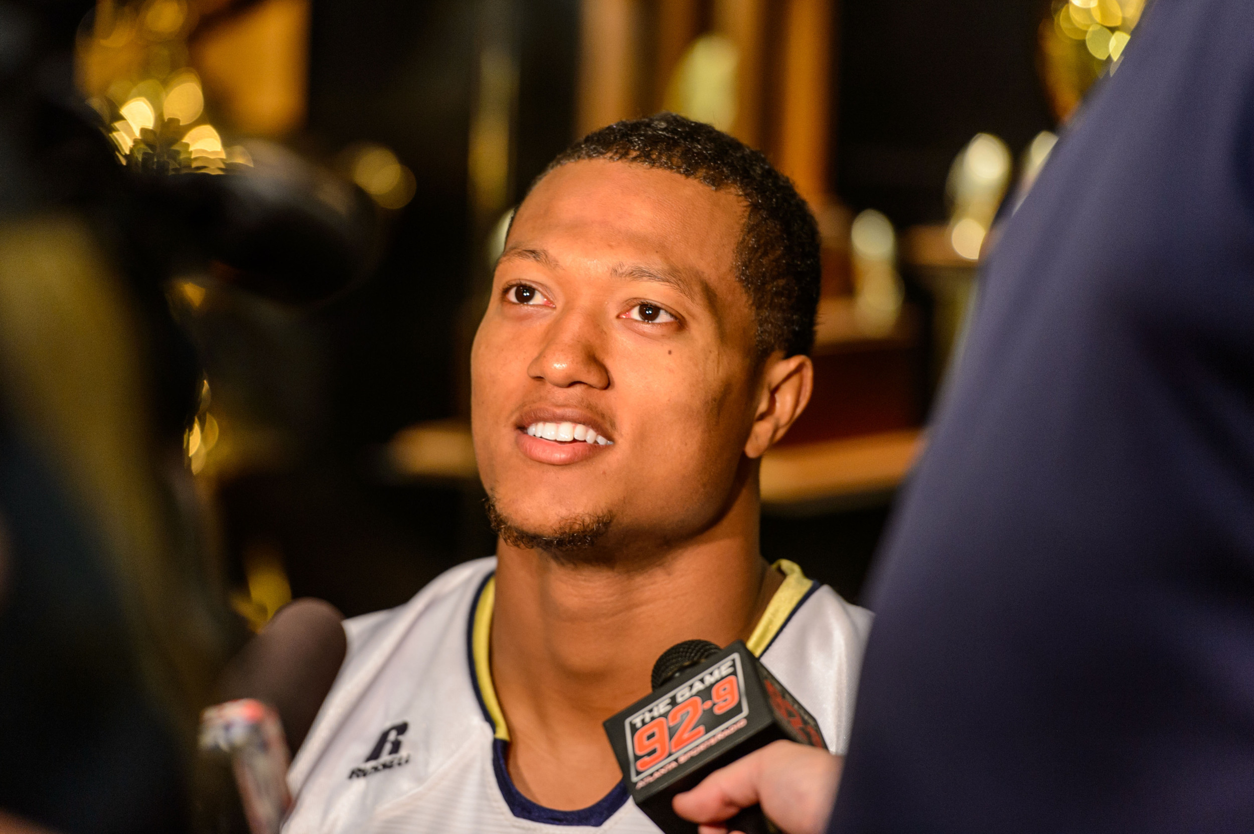 Isaiah Johnson (1) talks with the media