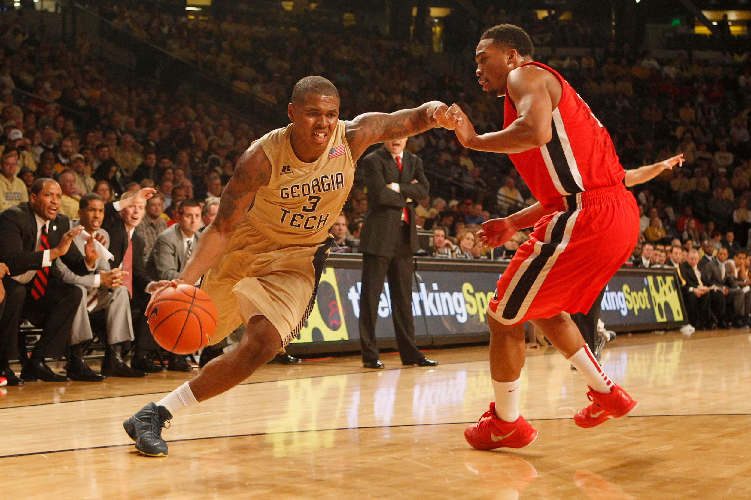 Nov 14, 2014; Atlanta, GA, USA; Georgia Tech Yellow Jackets forward Marcus Georges-Hunt (3) drives to the basket against the Georgia Bulldogs in the first half at McCamish Pavilion.