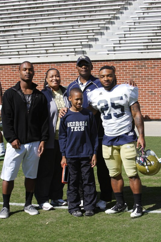 Robert Godhigh and family at the 2013 spring game. That&acirc;?<sup>TM</sup>s mom, Jeri Godhigh, in the back. &acirc;?oeShe&acirc;?<sup>TM</sup>s always been supportive of me &acirc;?
