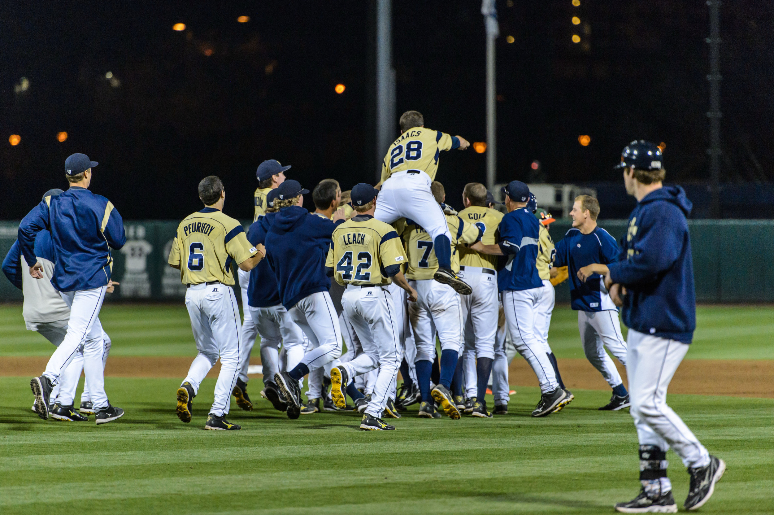 The team swarms Connor Justus after the walk-off win!