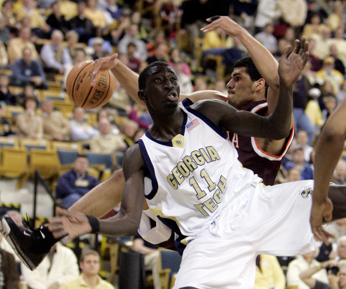 Georgia Tech's Mouhammad Faye (11) and Virginia Tech's A.D. Vassallo fight for a rebound during the first half of a basketball game, Sunday, Jan. 28, 2007. (AP Photo/John Bazemore)