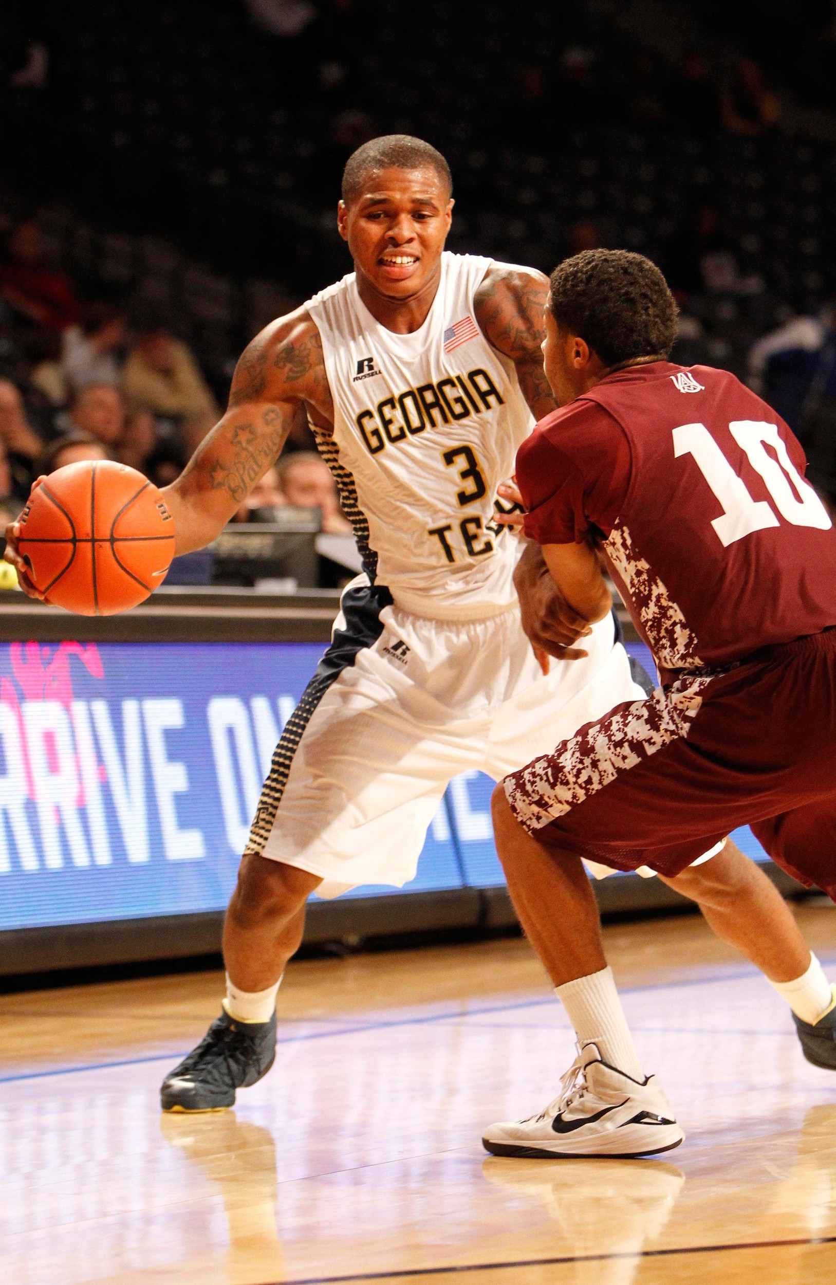 Nov 18, 2014; Atlanta, GA, USA; Yellow Jackets forward Marcus Georges-Hunt (3) is defended by Alabama A&M Bulldogs guard Rakiya Battle (10) in the first half. Brett Davis-USA TODAY Sports