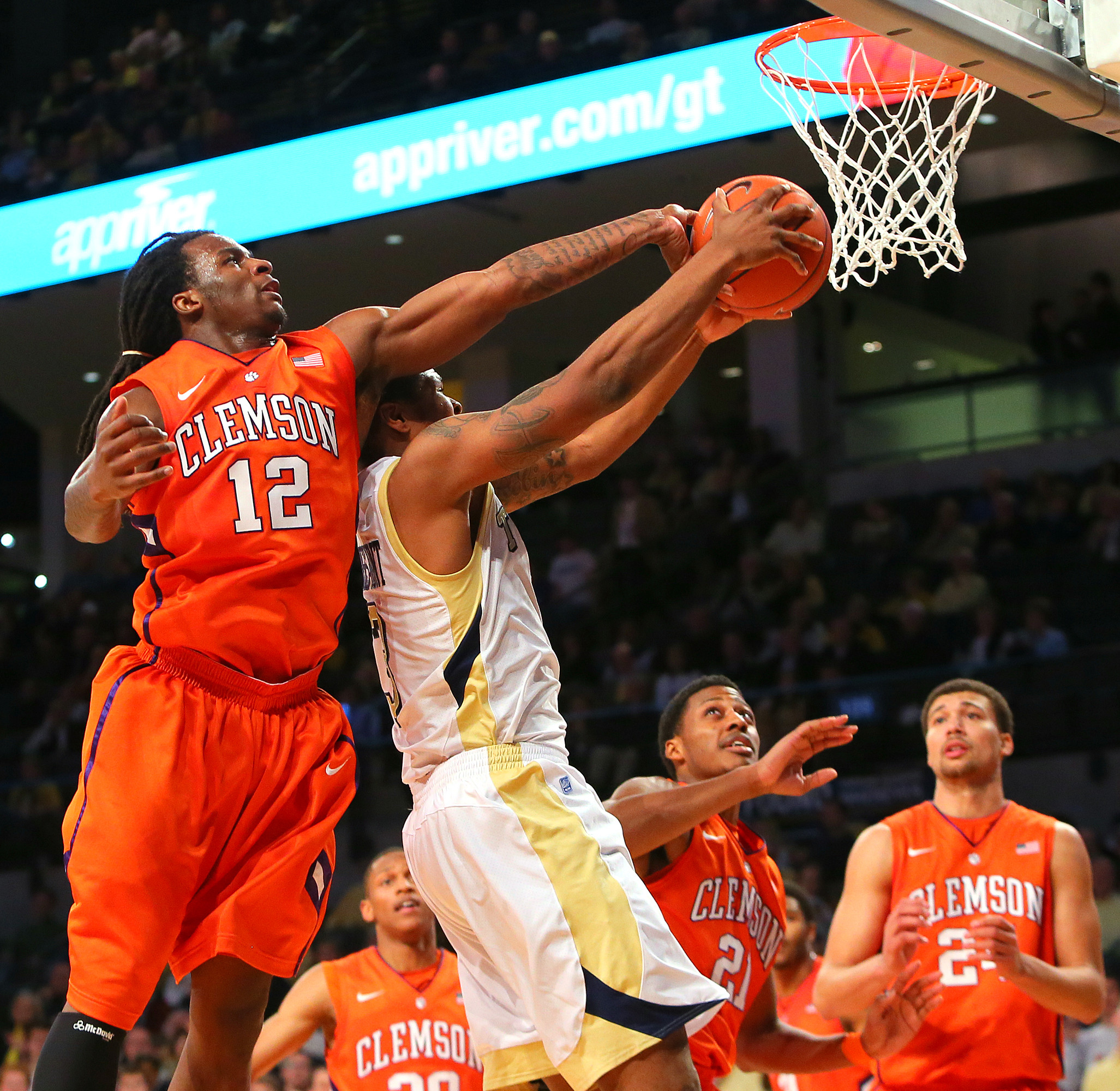 Clemson guard Rod Hall (12) blocks a shot by Georgia Tech guard Marcus Georges-Hunt during the first half of their NCAA college basketball game, Thursday, Feb. 14, 2013, in Atlanta. (AP Photo/Atlanta Journal-Constitution, Curtis Compton) MARIETTA DAILY OUT; GWINNETT DAILY POST OUT; LOCAL TV OUT; WXIA-TV OUT; WGCL-TV OUT