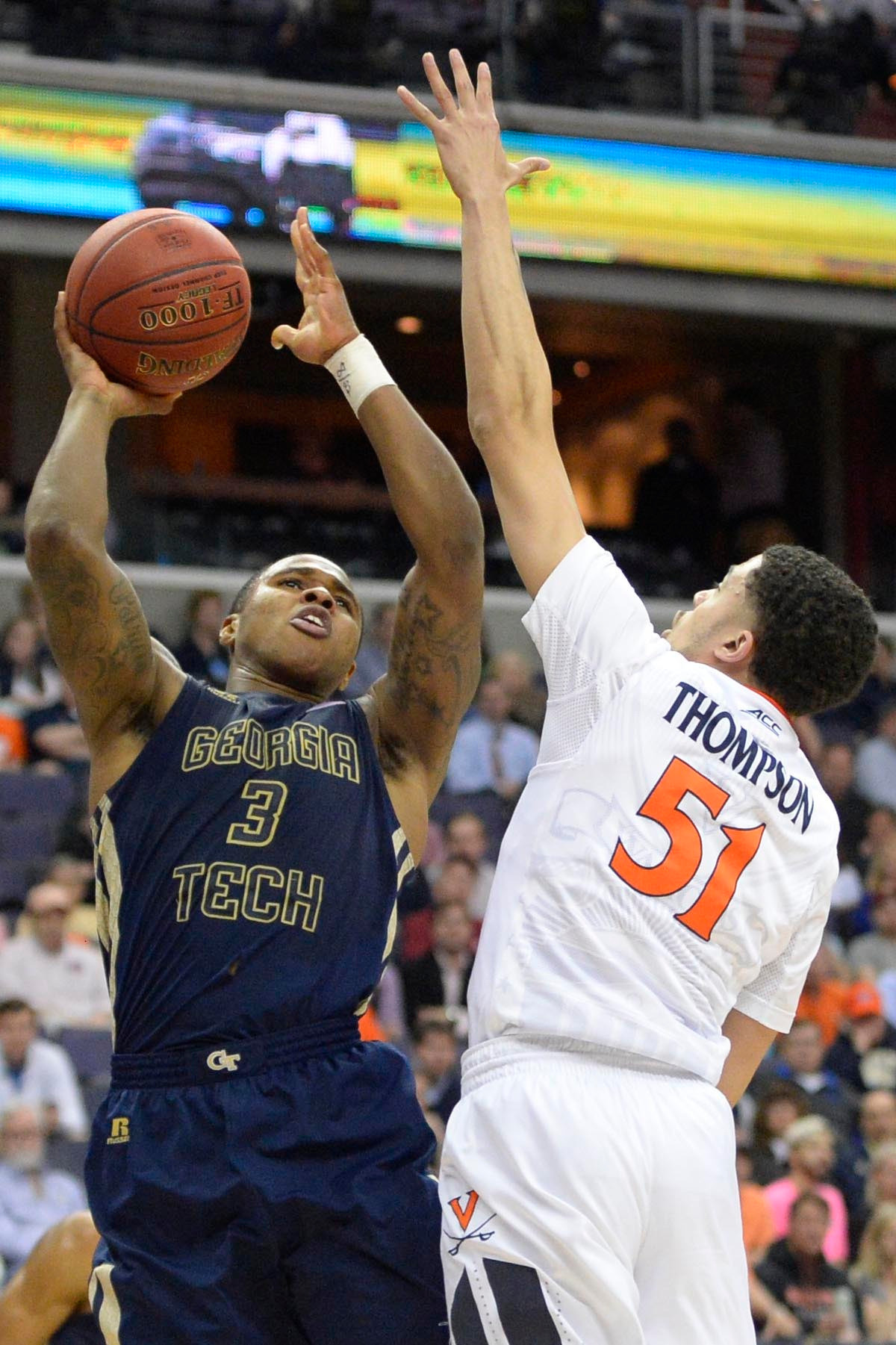Mar 10, 2016; Washington, DC, USA; Georgia Tech Yellow Jackets guard Marcus Georges-Hunt (3) shoots over Virginia Cavaliers guard Darius Thompson (51). Credit: Tommy Gilligan-USA TODAY Sports