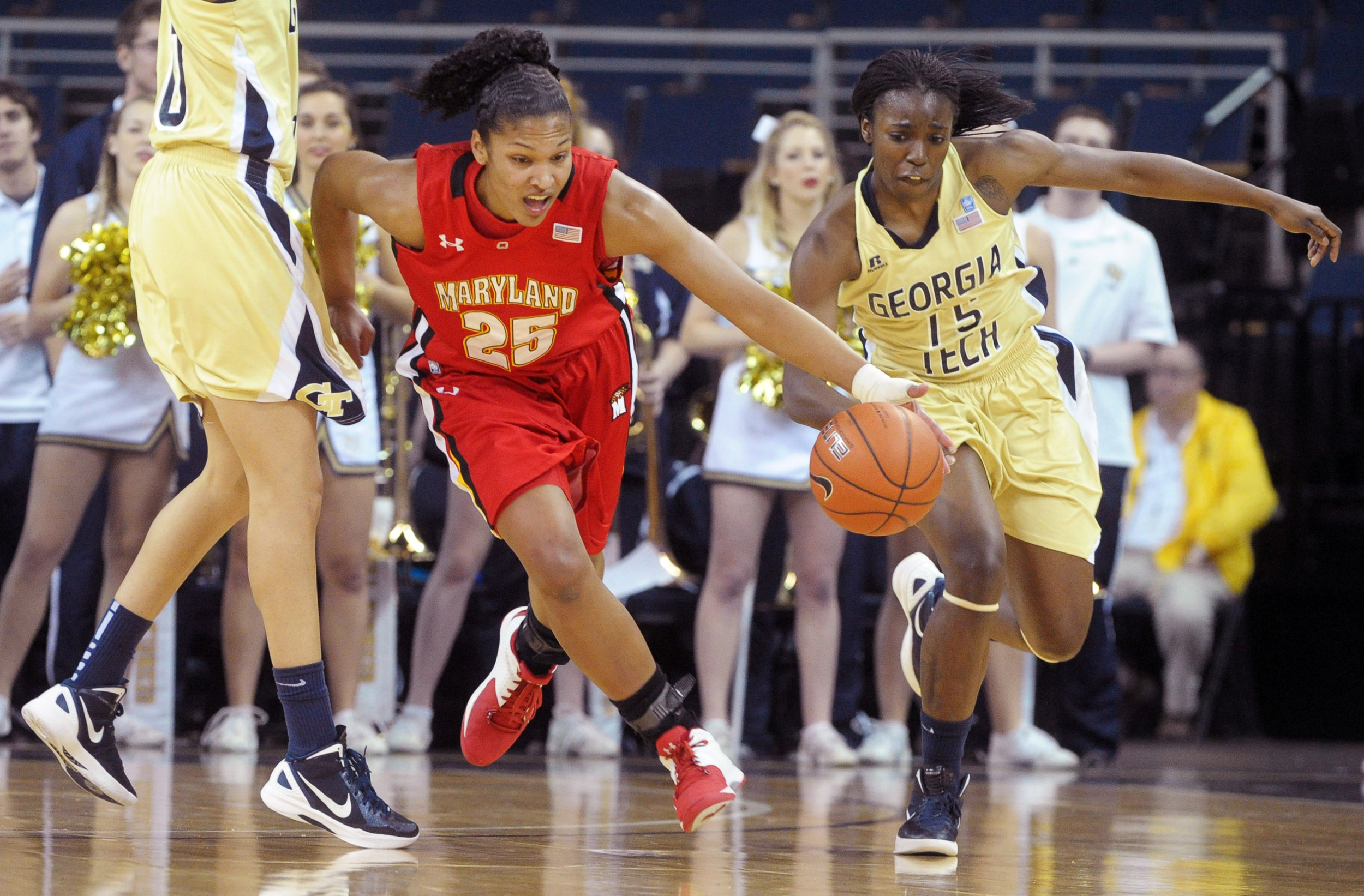 Maryland forward AlyssaThomas (25) pushes the ball up the floor past Georgia Tech forward Danielle Hamilton-Carter, left, as guard Tyaunna Marshall (15) gives chase, during the first half of an NCAA college basketball game, Monday, Feb. 6 , 2012, in Duluth. Ga. (AP Photo/John Amis)