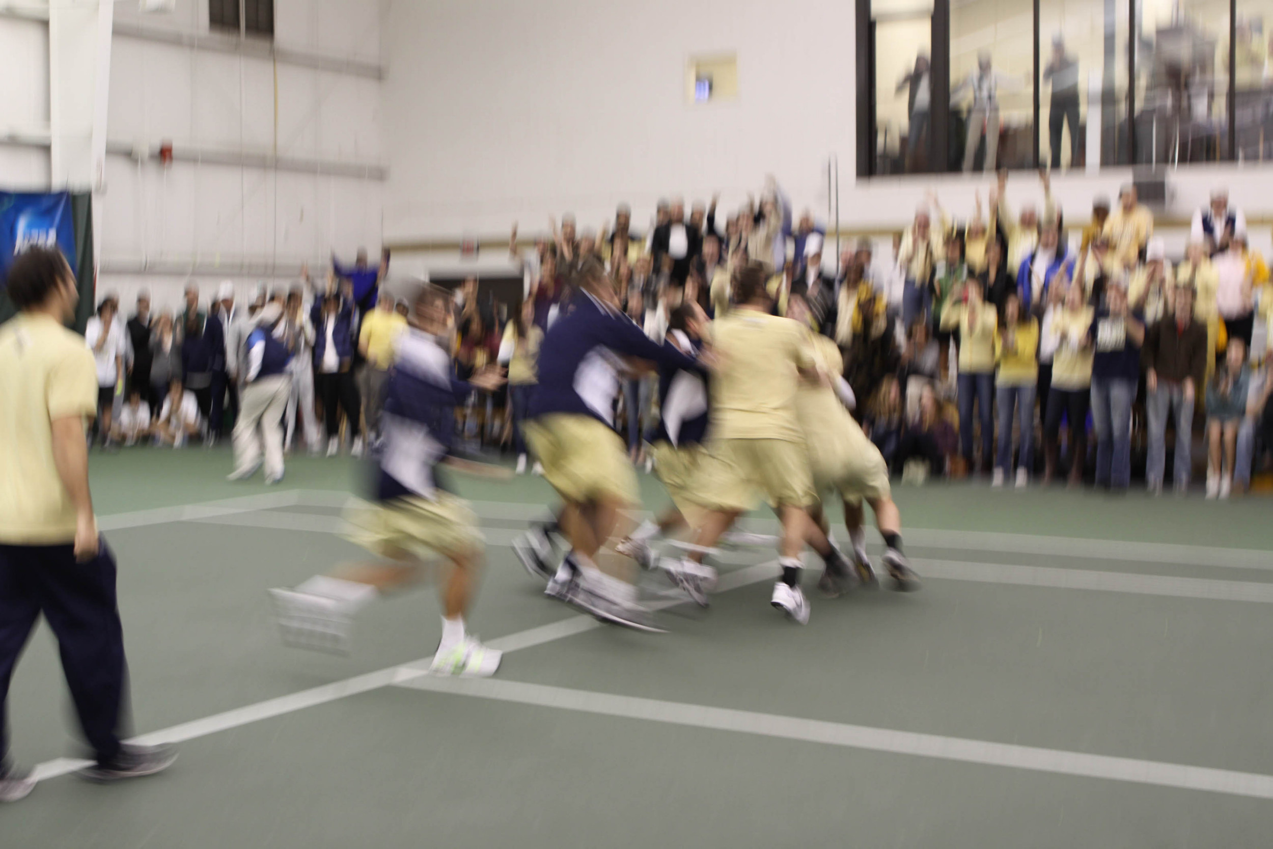 The team rushes the court