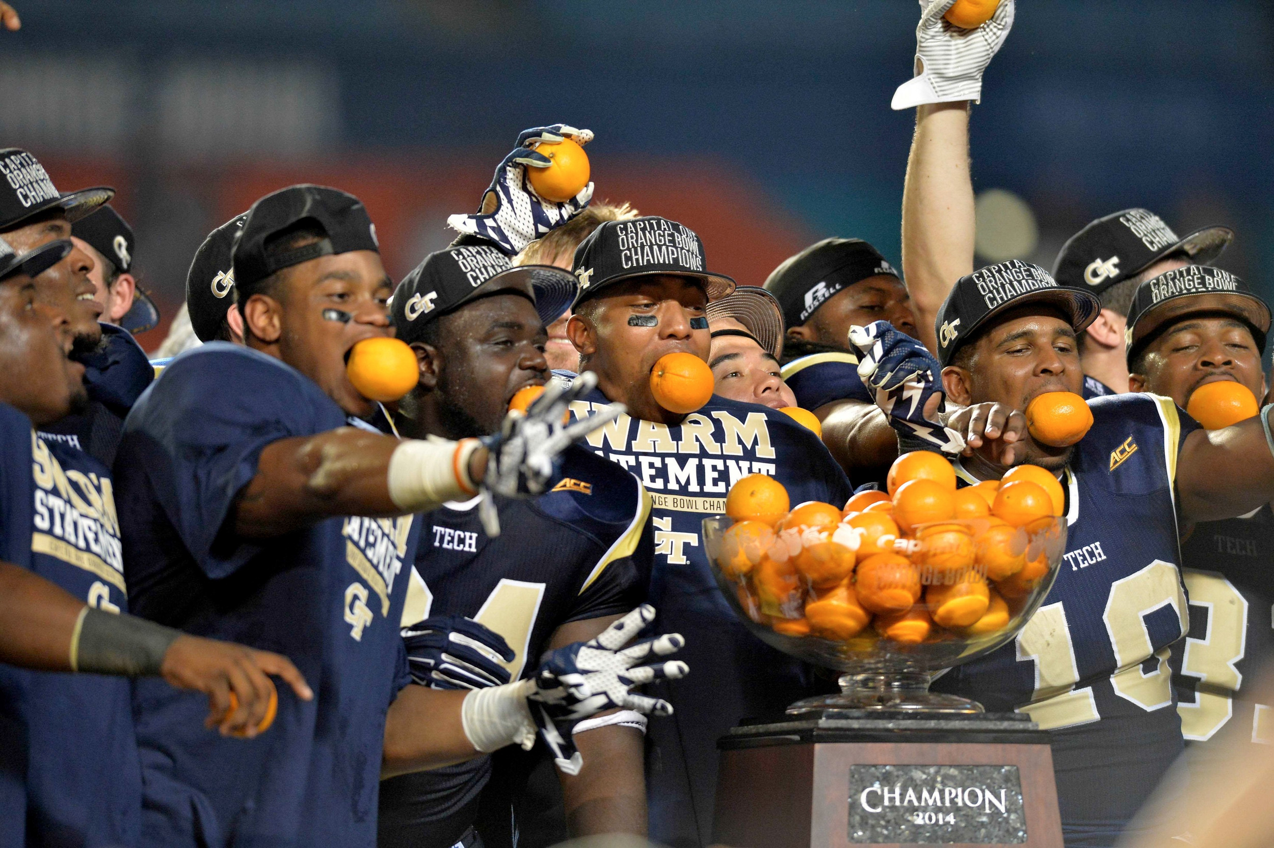 Dec 31, 2014; Miami Gardens, FL, USA; Georgia Tech Yellow Jackets players celebrate their 49-34 win over the Mississippi State Bulldogs in the 2014 Orange Bowl at Sun Life Stadium. Mandatory Credit: Steve Mitchell-USA TODAY Sports