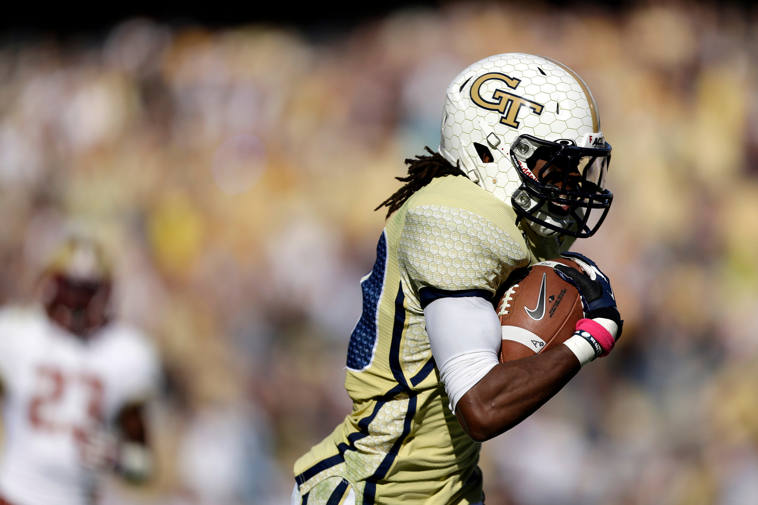 Georgia Tech wide receiver Anthony Autry runs for a touchdown on a pass by quarterback Vad Lee, not pictured, during the second quarter. (AP Photo/David Goldman)