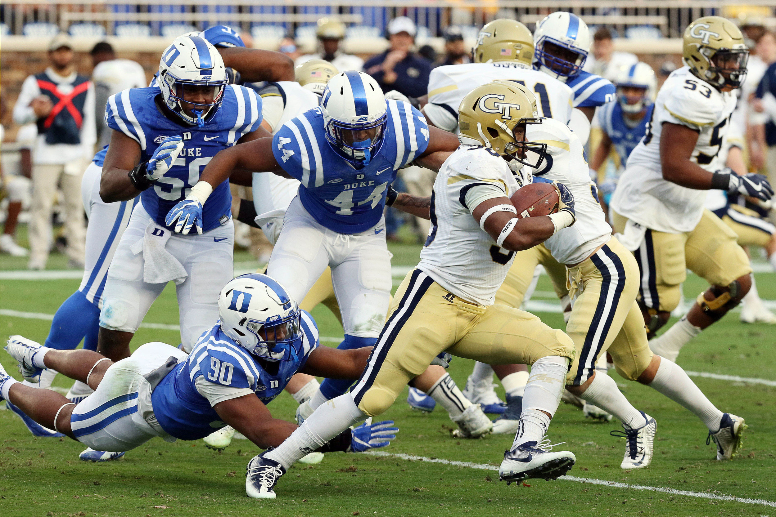 Nov 18, 2017; Durham, NC, USA; Georgia Tech Yellow Jackets running back KirVonte Benson (30) runs the ball against the Duke Blue Devils defense in the first half at Wallace Wade Stadium. Mandatory Credit: Mark Dolejs-USA TODAY Sports