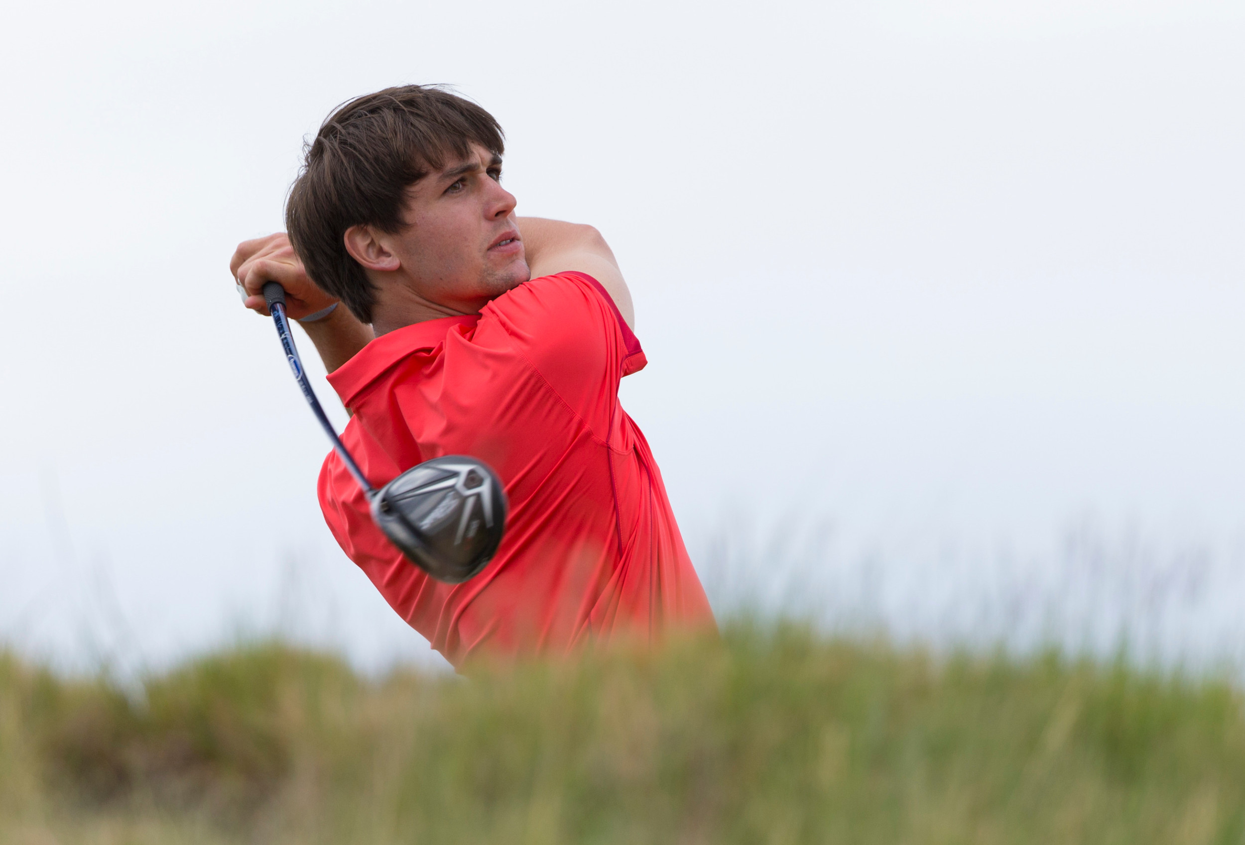 Oliver Schniederjans plays his tee shot on the 16th hole during the first round of the 2015 U.S. Open at Chambers Bay in University Place, Wash. on Thursday, June 18, 2015. (Copyright USGA/Darren Carroll)