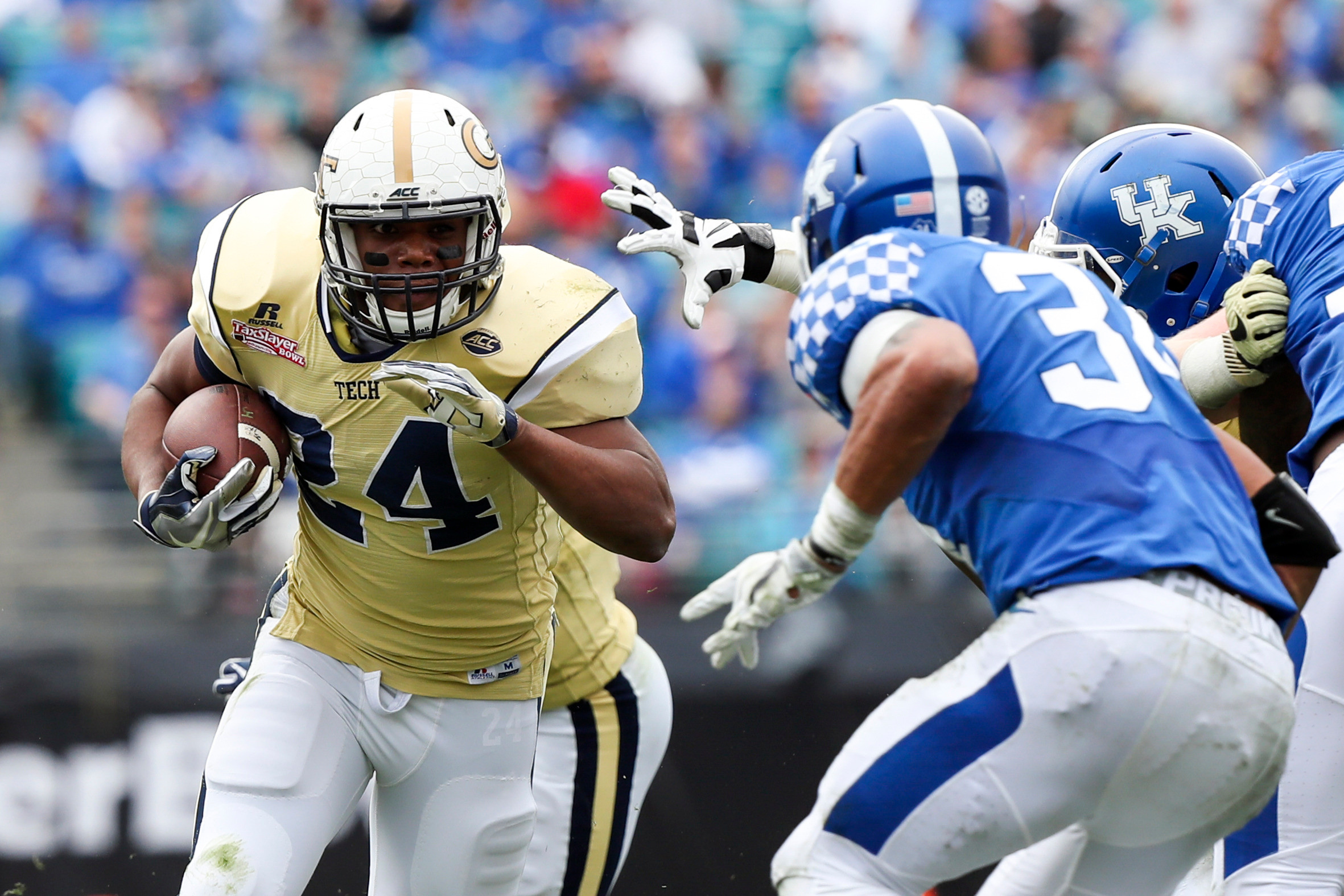 Georgia Tech Yellow Jackets running back Marcus Allen (24) runs the ball in the second half as Kentucky Wildcats linebacker Jordan Jones (34) defends at EverBank Field. Logan Bowles-USA TODAY Sports