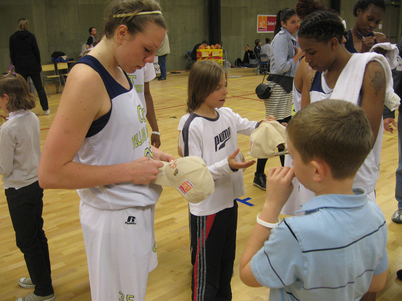 Brigitte Ardossi signing autographs after the game