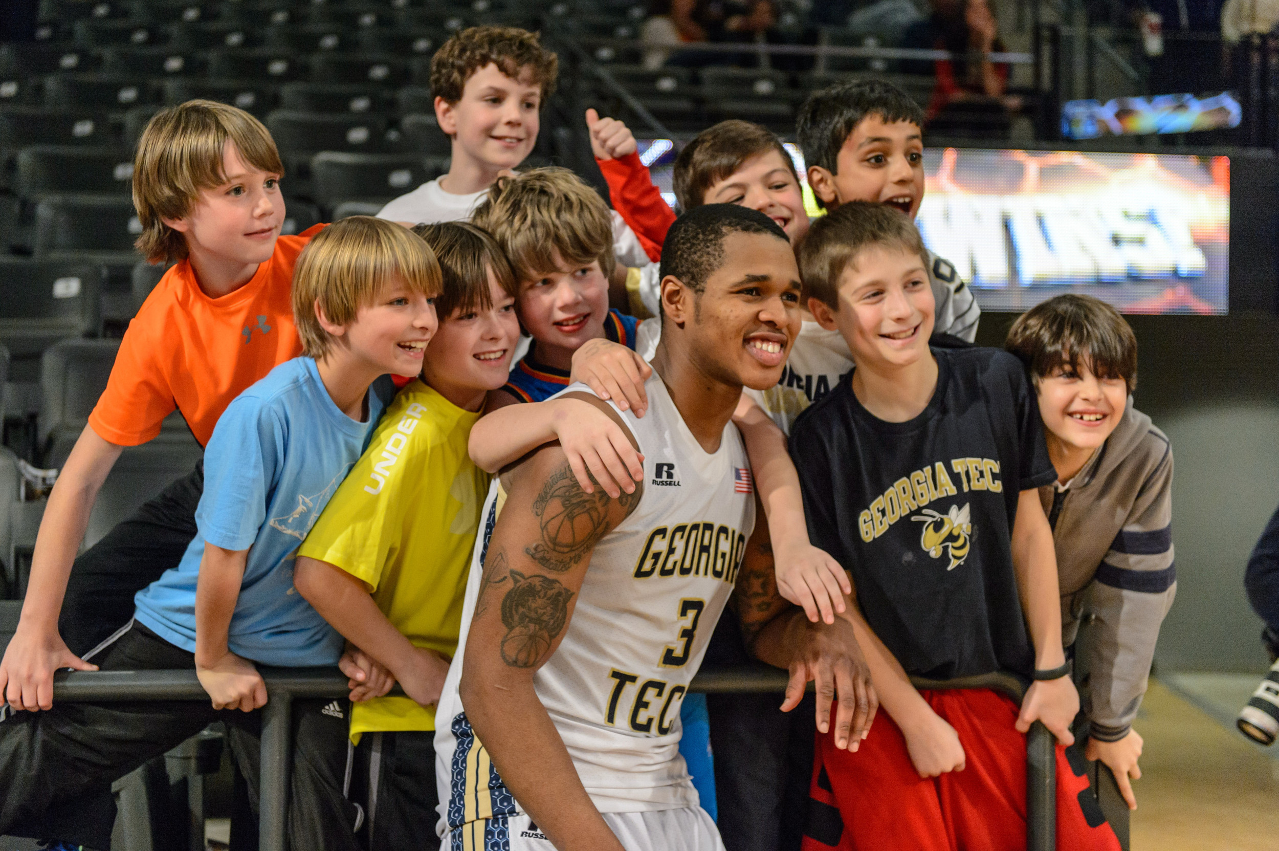 Marcus Georges-Hunt (3) takes a photo with fans after the win.