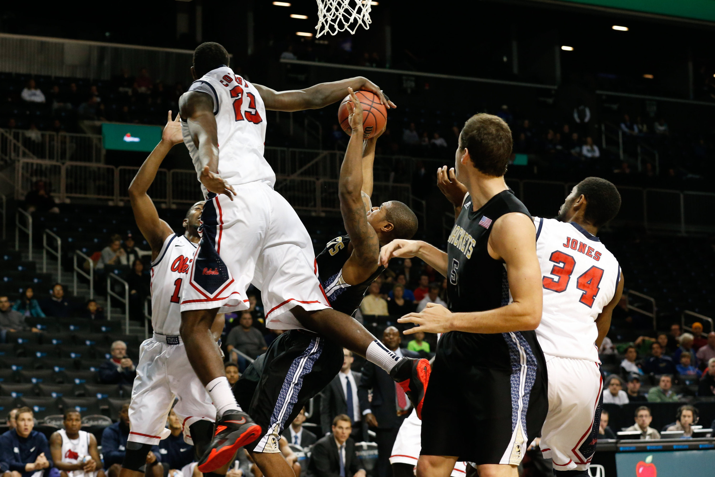 Nov 29, 2013; Brooklyn, NY, USA; Mississippi Rebels center Dwight Coleby (23) keeps Georgia Tech Yellow Jackets guard/forward Marcus Georges-Hunt (3) from the net during the first half at Barclays Center. Mandatory Credit: Anthony Gruppuso-USA TODAY Sports