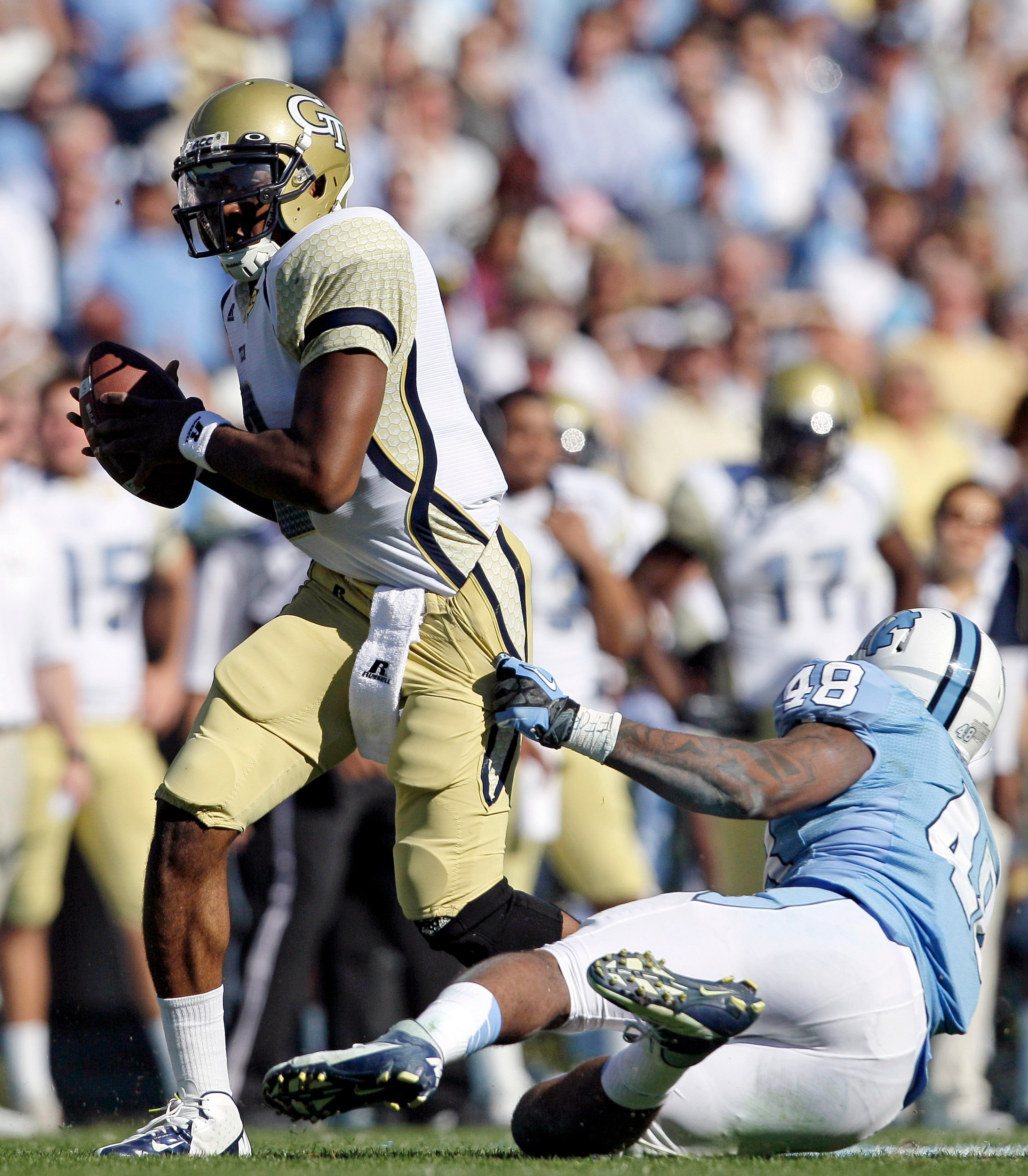 North Carolina's Kevin Reddick grabs Georgia Tech quarterback Vad Lee during the first half. (AP Photo/Gerry Broome)