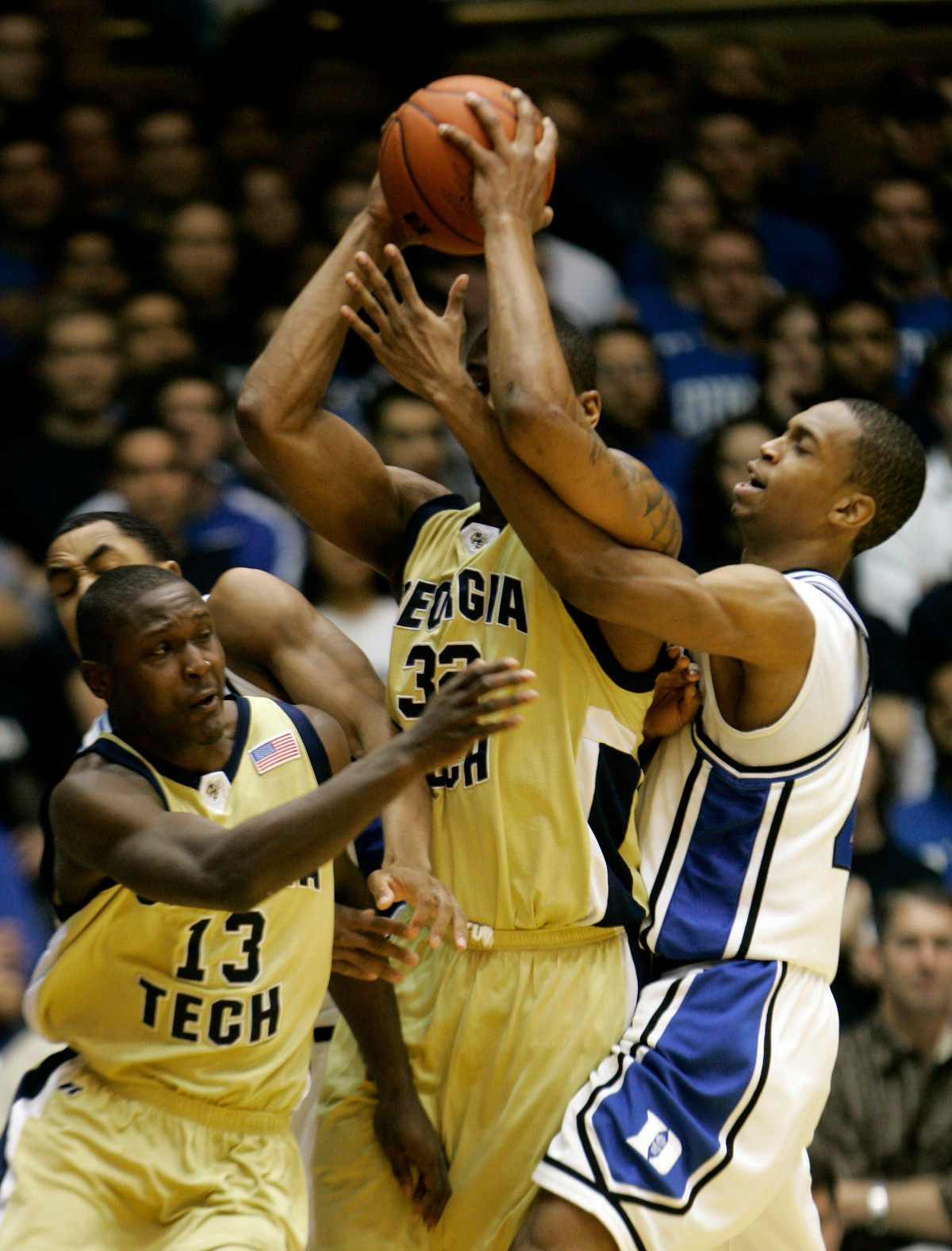 Duke's Lance Thomas, right, guards Georgia Tech's Jeremis Smith, center, as Georgia Tech's D'Andre Bell (13) runs past at left during the first half of a college basketball game in Durham, N.C., Sunday, Feb. 18, 2007. (AP Photo/Gerry Broome)