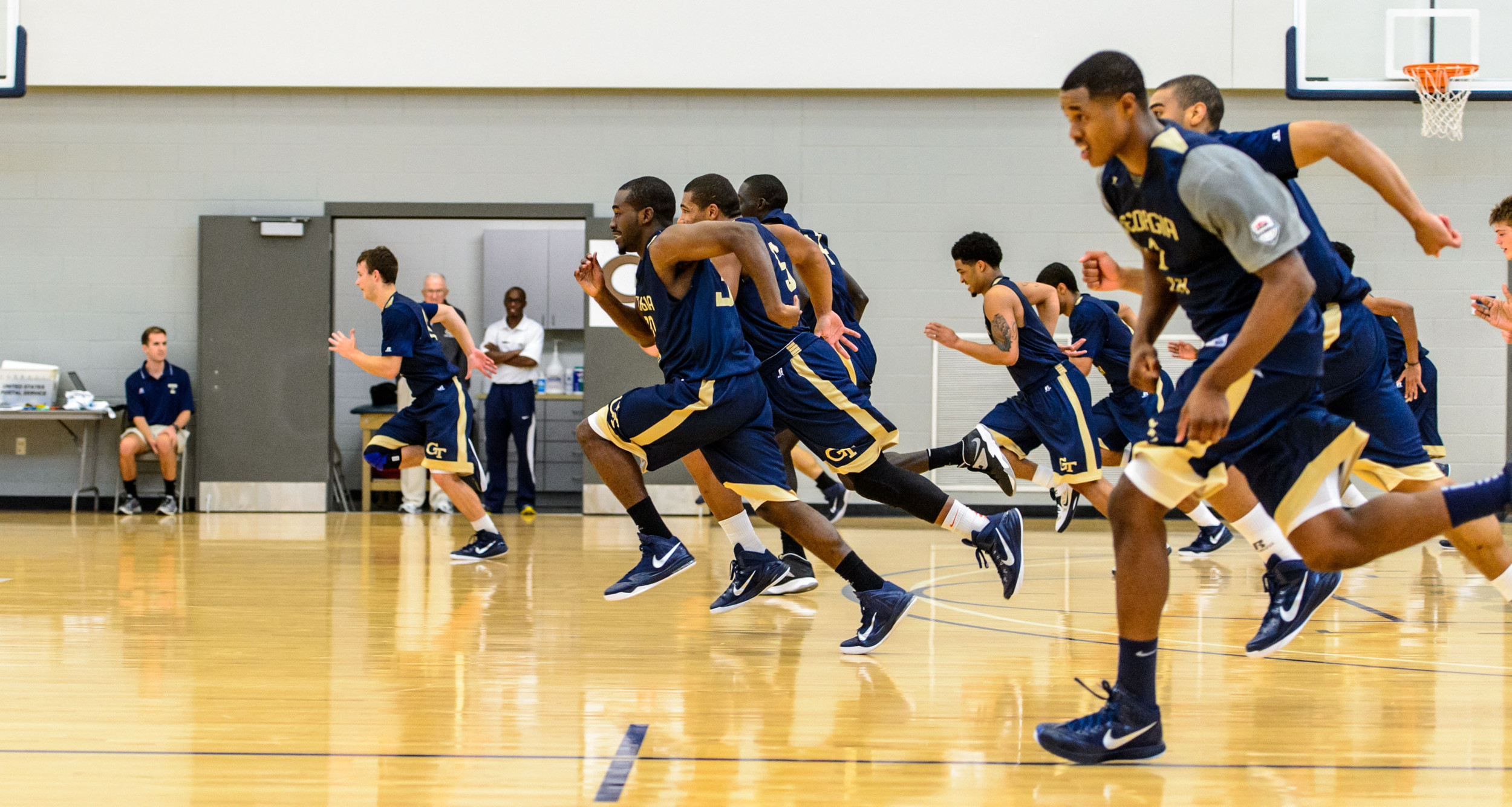 The team runs down the court