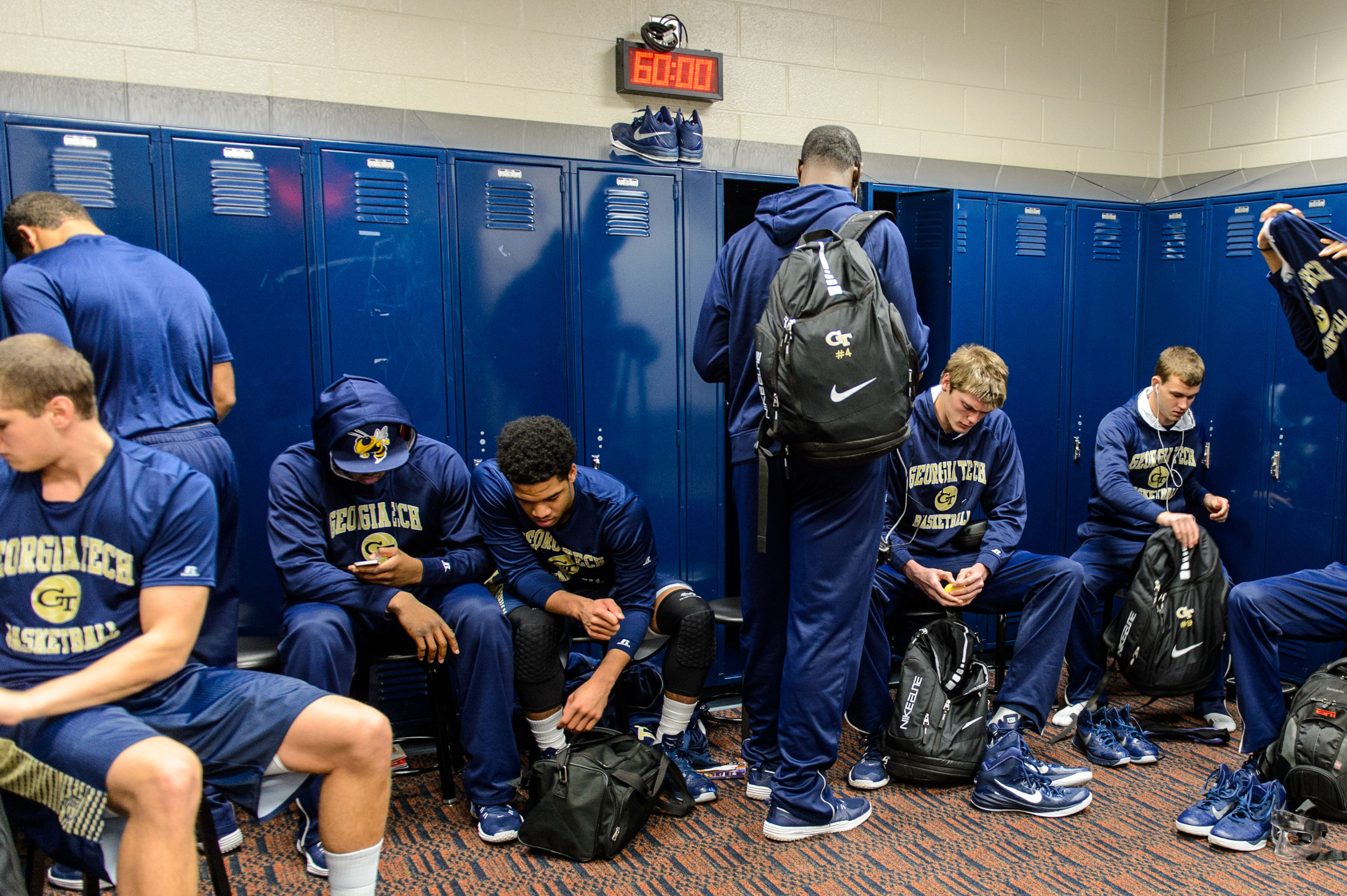 Players arrive in the locker room and begin to get ready for pre-game warm ups.