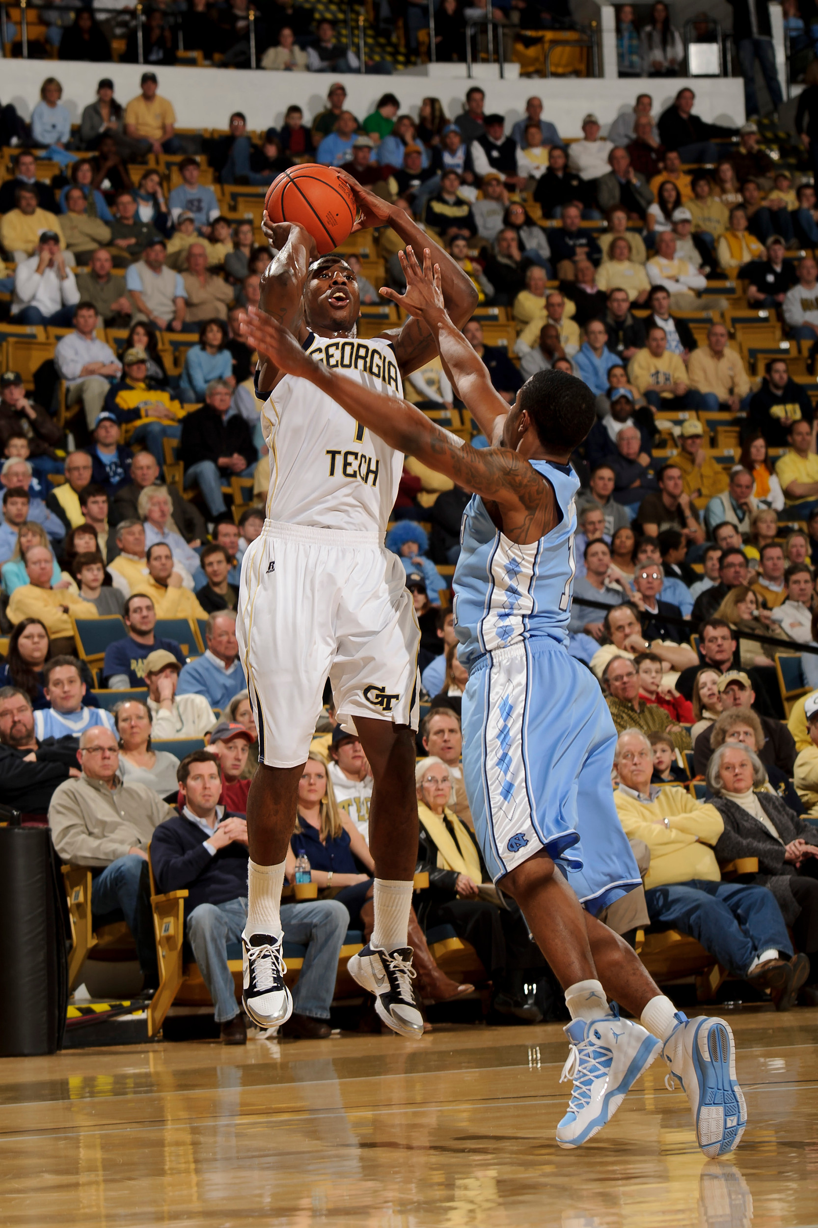 Jan 16, 2011; Atlanta, GA, USA; Georgia Tech Yellow Jackets guard Iman Shumpert (1) pulls up for a shot over a North Carolina Tar Heels defender during the first half at Alexander Memorial Coliseum. Mandatory Credit: Paul Abell-Abell Images