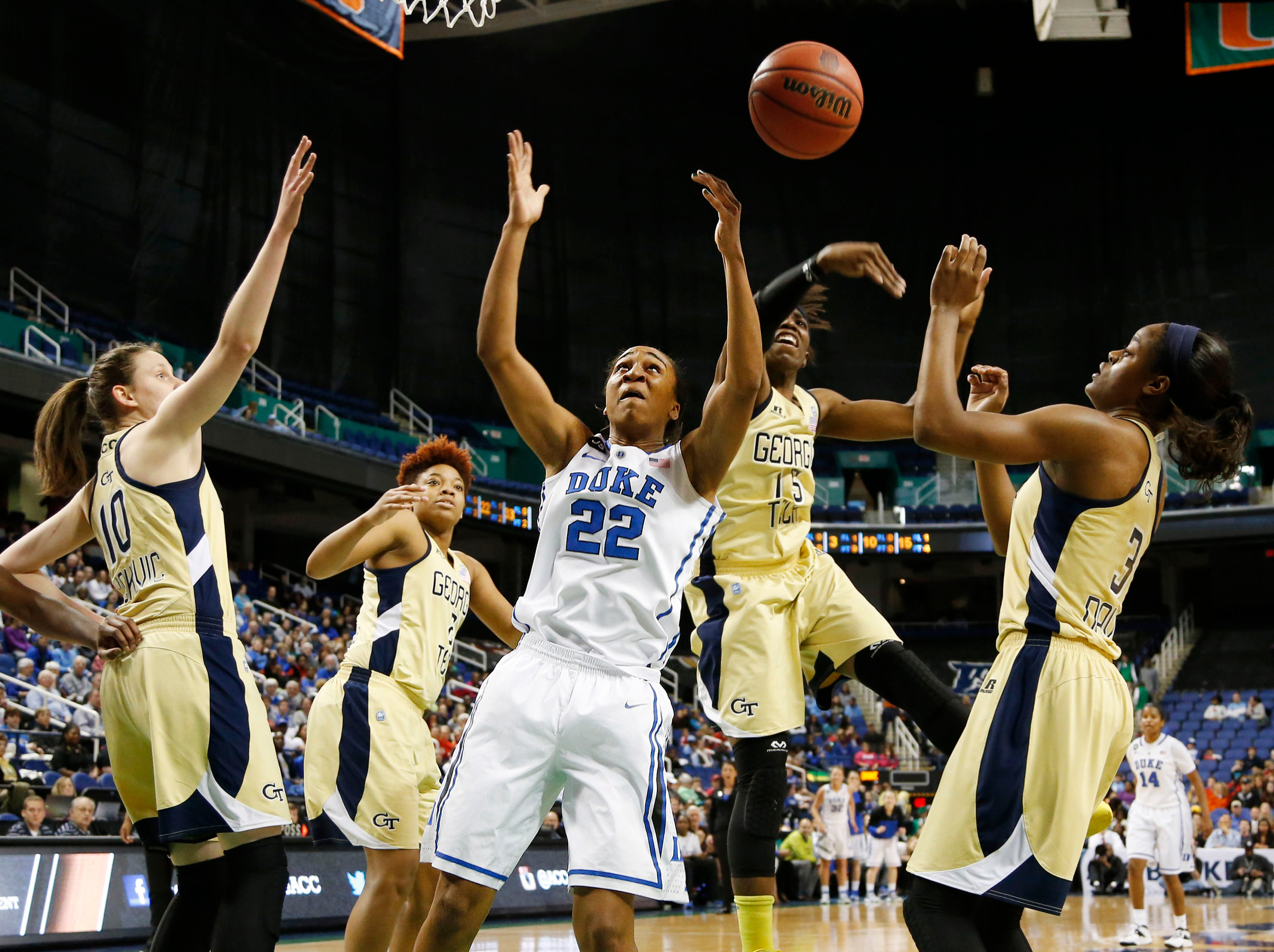 Mar 7, 2014; Greensboro, NC, USA; Duke University Blue Devils player Oderah Chidom (22) battles Georgia Tech Yellow Jackets guard Tyaunna Marshall (15) and Kela Davis (3) for a reboud as Katarina Vockovic (10), Aaliyah Whiteside (2) look on at Greensboro Coliseum. Mandatory Credit: Ellen Ozier-USA TODAY Sports