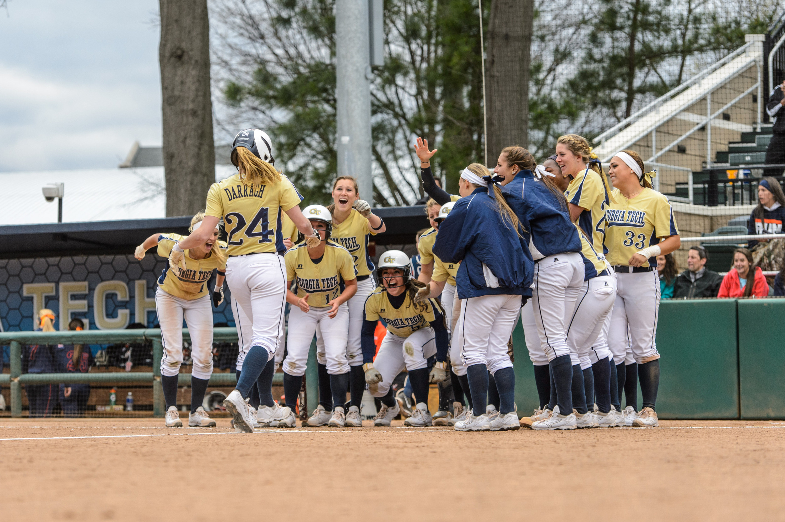 Colleen Darragh (24) is welcomed at the plate by the team after hitting a walk-off grand slam!