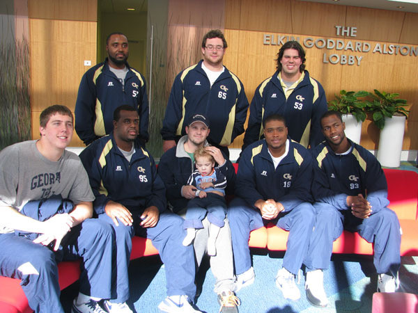 Yellow Jackets visit children at Egleston Hospital.