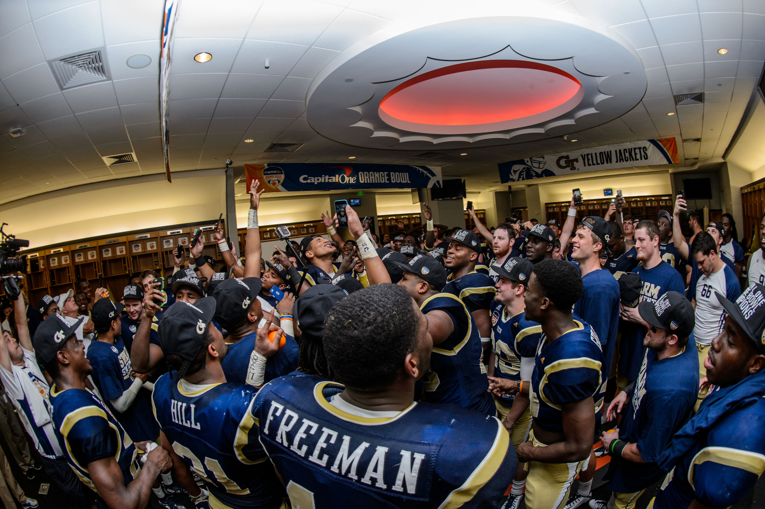 The team sings the fight song after the win