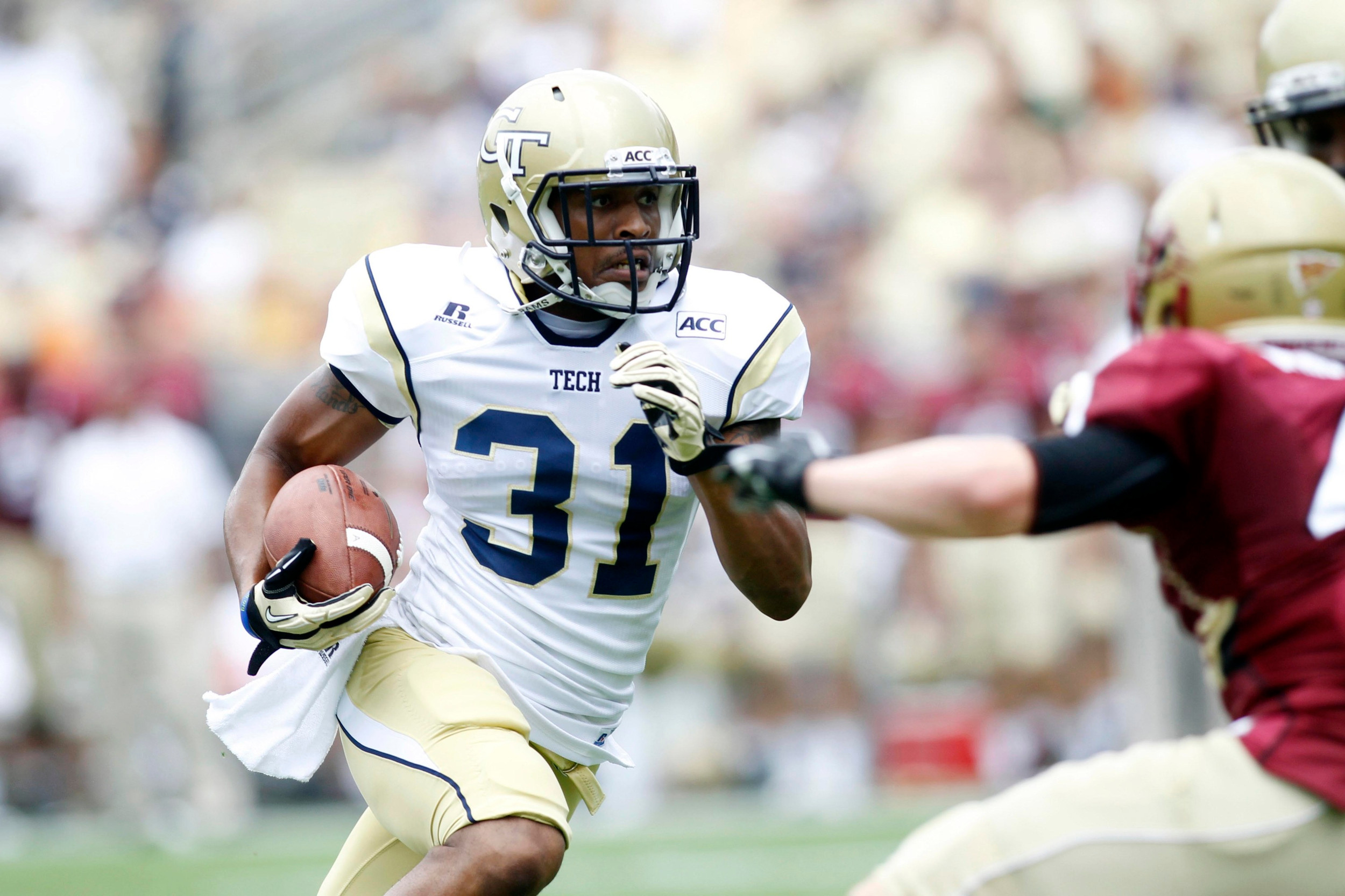 Aug 31, 2013; Atlanta, GA, USA; Georgia Tech Yellow Jackets running back Deon Hill (31) runs the ball against the Elon Phoenix in the first quarter at Bobby Dodd Stadium. Mandatory Credit: Brett Davis-USA TODAY Sports