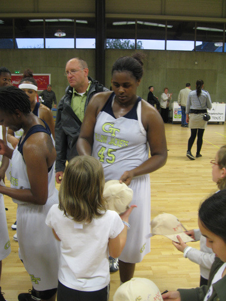Sasha Goodlett signing autographs after the game
