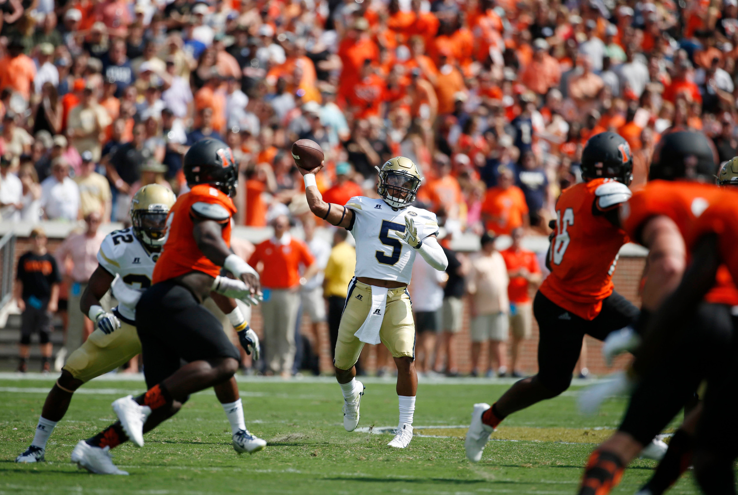Yellow Jackets quarterback Justin Thomas (5) attempts a pass in the first quarter of their game against the Mercer Bears. Jason Getz-USA TODAY Sports