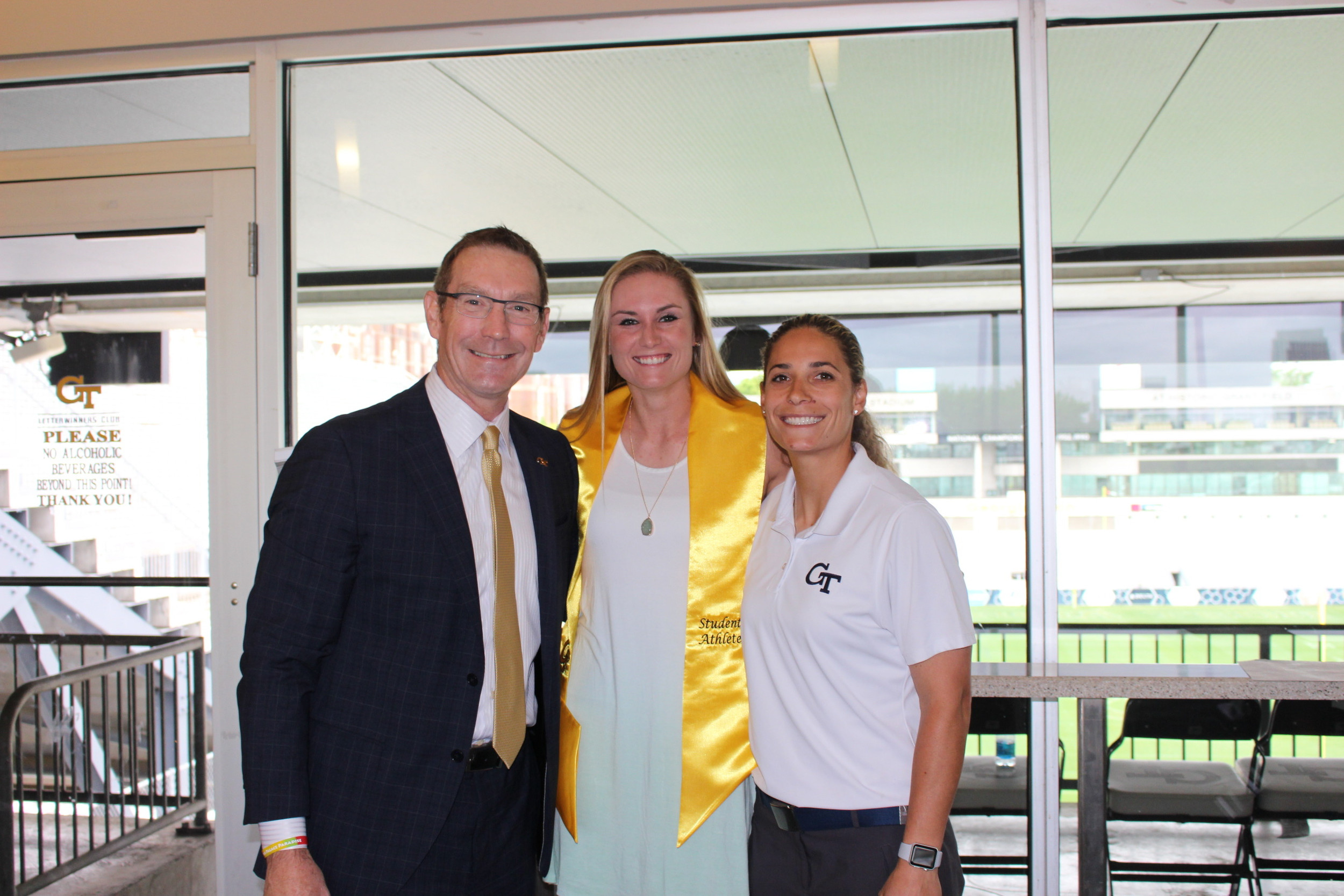 Director of Athletics Todd Stansbury, Draven Sonnon, head coach Aileen Morales