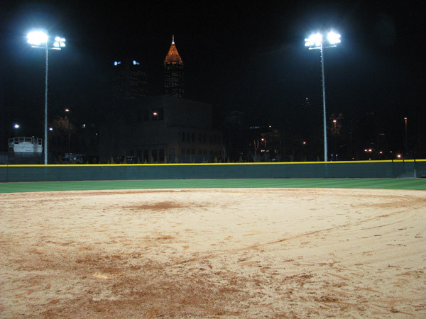 Softball team practices at night for the first time in its new stadium.