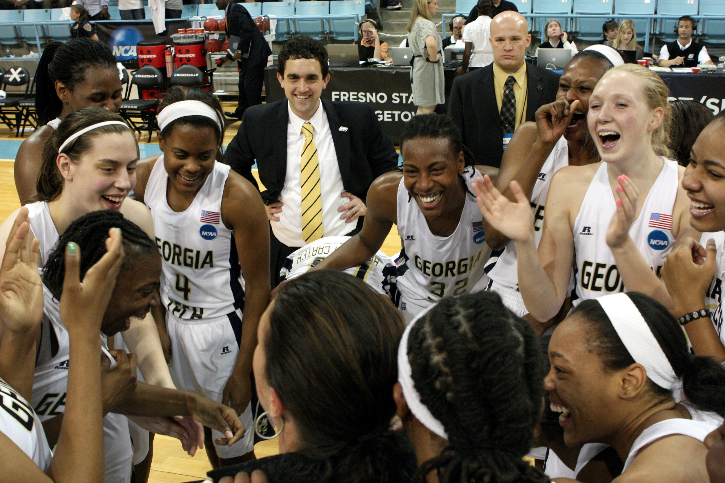 Georgia Tech team huddle after beating Georgetown.