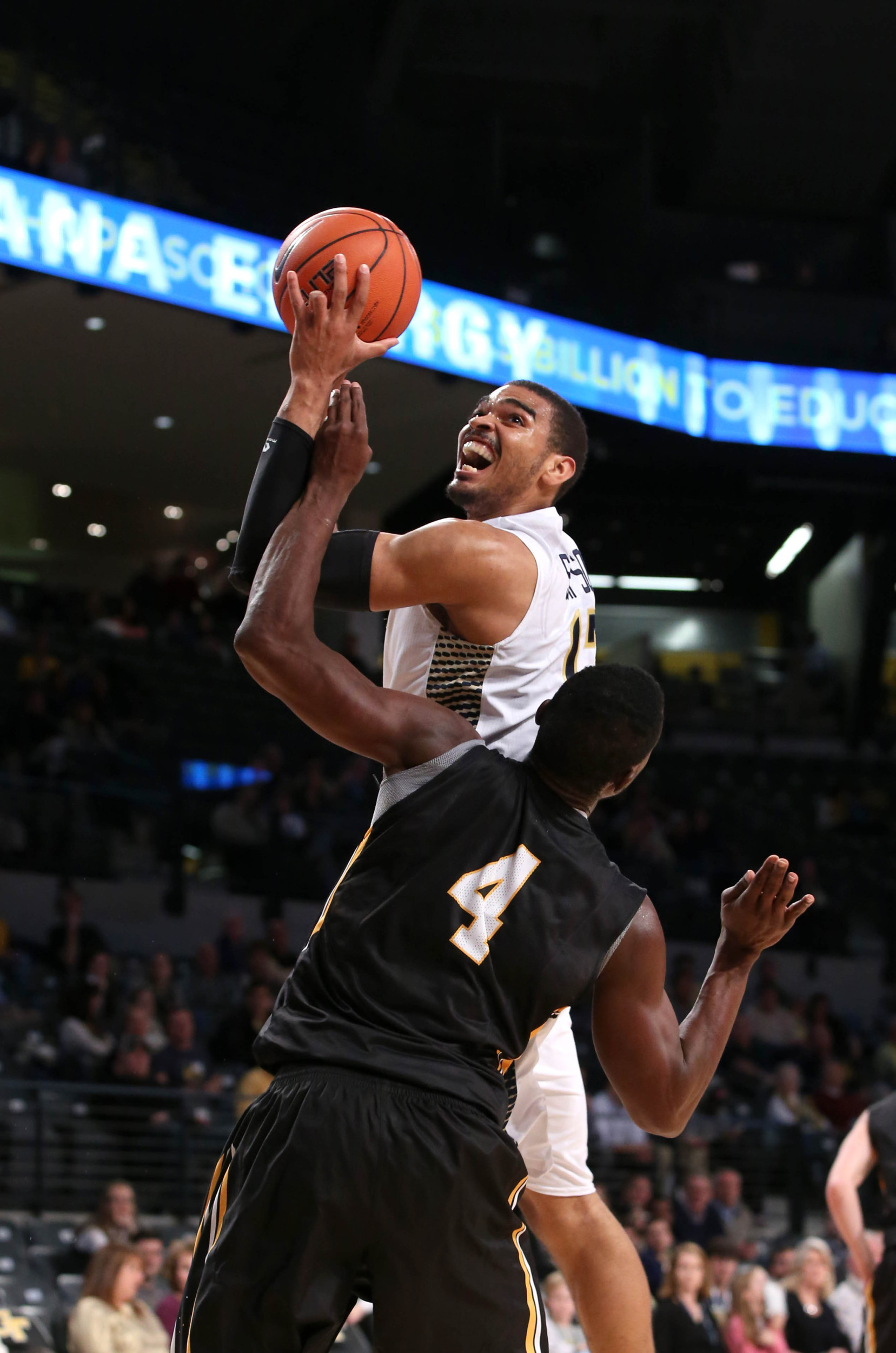 Dec 15, 2014; Atlanta, GA, USA; Georgia Tech Yellow Jackets forward Robert Sampson (13) attempts a shot as he is fouled by Appalachian State Mountaineers forward Michael Obacha (4) in the second half of their game at McCamish Pavilion. Georgia Tech won 70-57. Mandatory Credit: Jason Getz-USA TODAY Sports