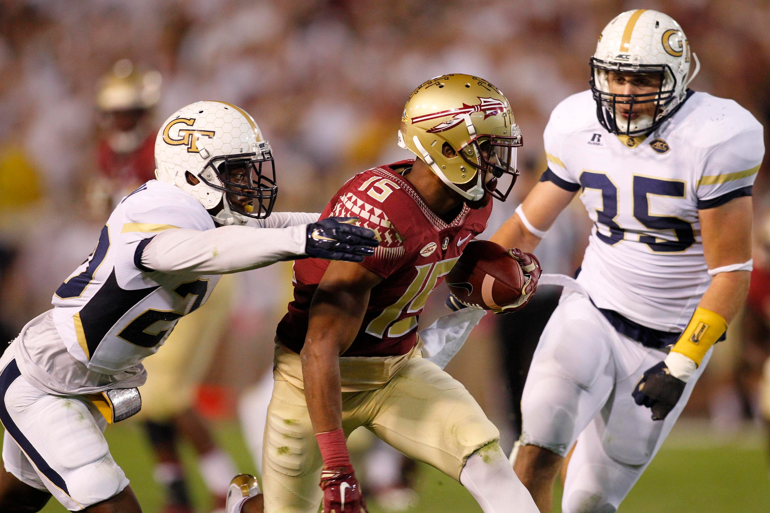 Florida State Seminoles wide receiver Travis Rudolph (15) is tackled by Georgia Tech Yellow Jackets defensive back Lawrence Austin (20) and linebacker Tyler Marcordes (35) in the second quarter at Bobby Dodd Stadium. Credit: Brett Davis-USA TODAY Sports