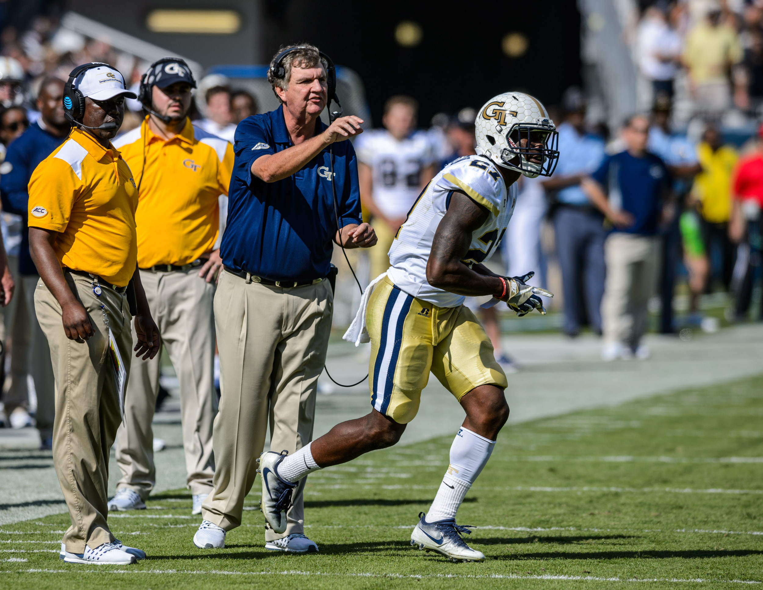 Lynn Griffin (27), Coach Paul Johnson, Assistant Coach Lamar Owens