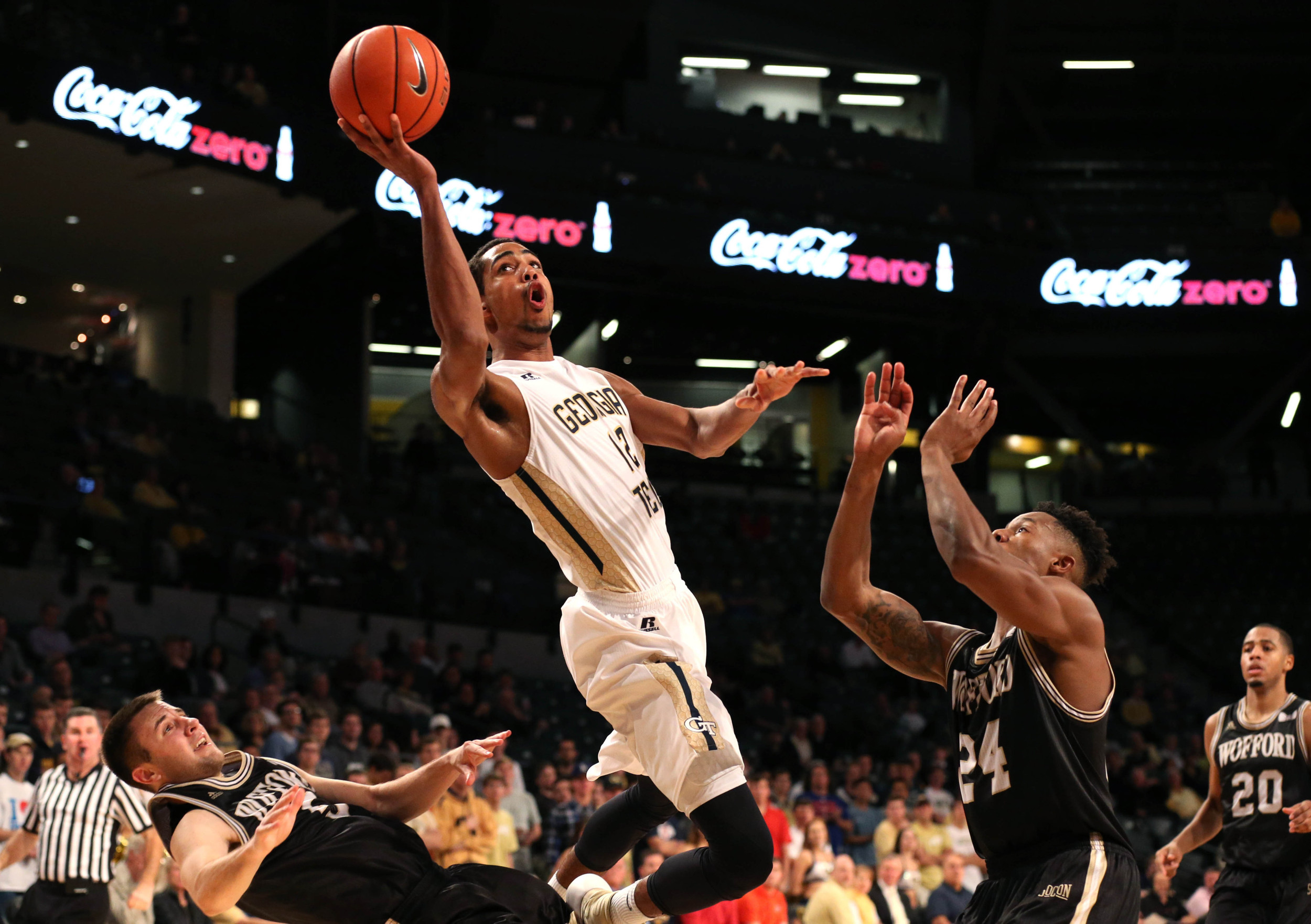 Dec 1, 2015; Atlanta, GA, USA; Georgia Tech Yellow Jackets forward Quinton Stephens (12) attempts a shot against Wofford Terriers guard Fletcher Magee (3, left) and forward Justin Gordon (24) in the second half of their game at McCamish Pavilion. The Yellow Jackets won 77-61. Mandatory Credit: Jason Getz-USA TODAY Sports