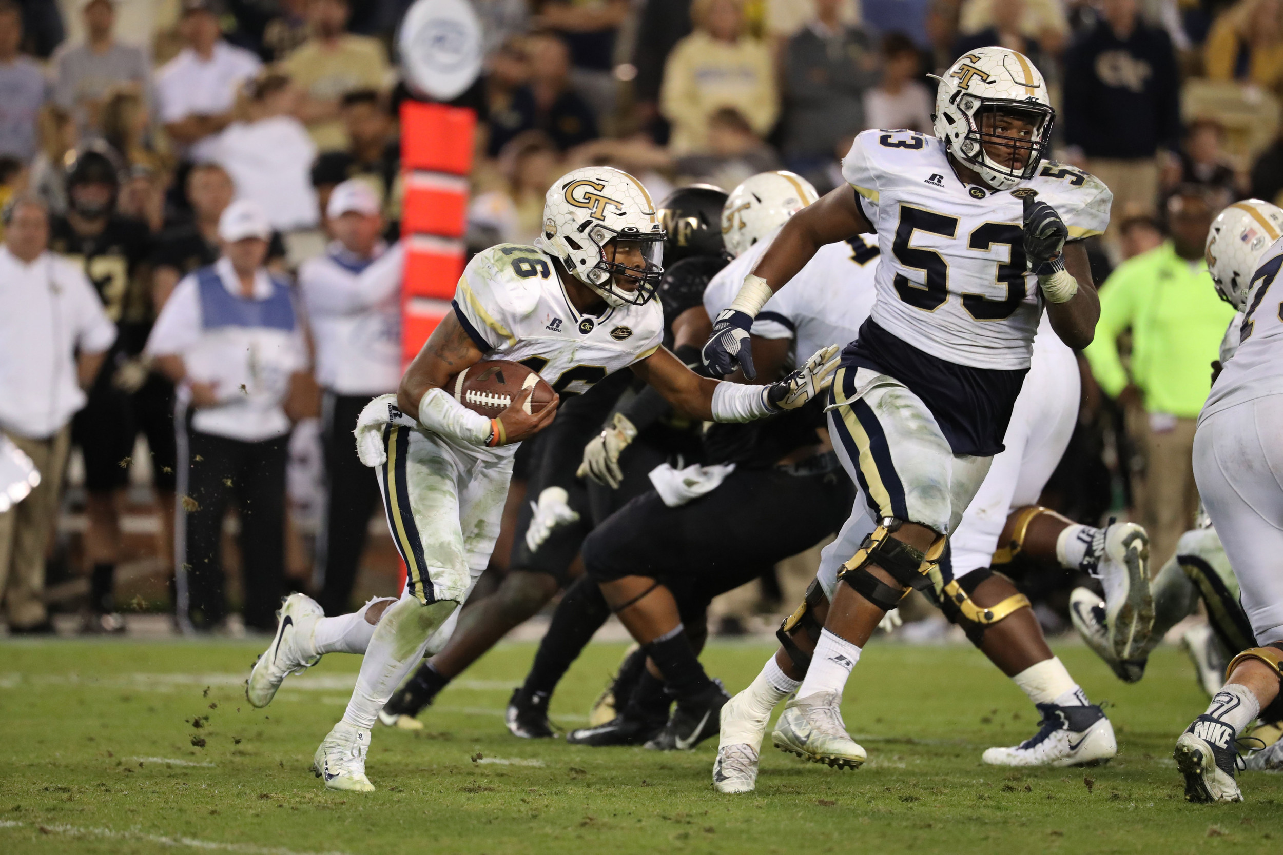 Oct 21, 2017; Atlanta, GA, USA; Georgia Tech Yellow Jackets quarterback TaQuon Marshall (16) runs for a long touchdown behind the block of offensive lineman Jahaziel Lee (53) in the fourth quarter against the Wake Forest Demon Deacons at Bobby Dodd Stadium. Mandatory Credit: Jason Getz-USA TODAY Sports