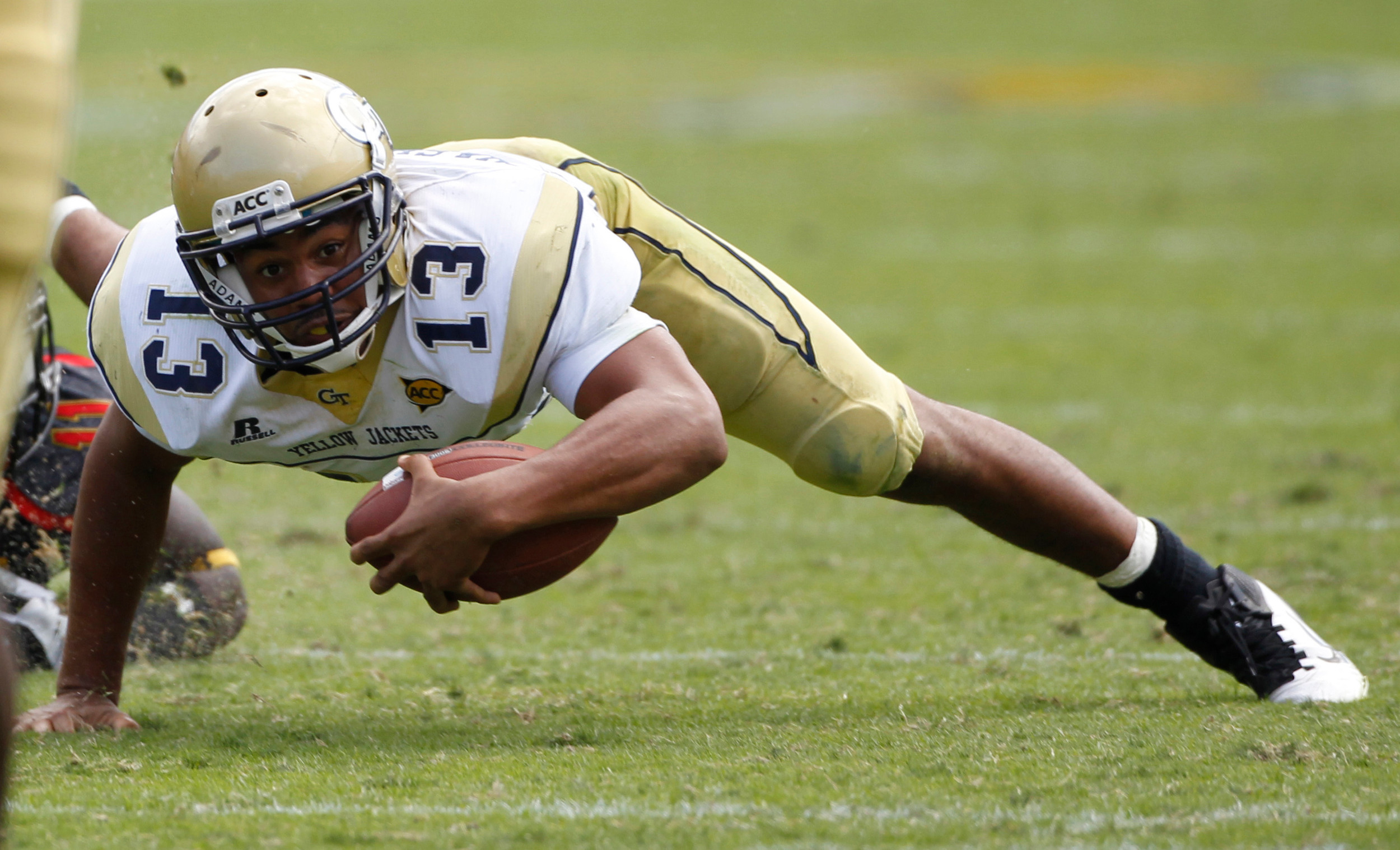 Georgia Tech quarterback Tevin Washington (13) dives forward for extra yardage after scrambling in the third quarter of an NCAA college football game against Maryland, Saturday, Oct, 8, 2011 in Atlanta. Tech won 20-16. (AP Photo/John Bazemore)