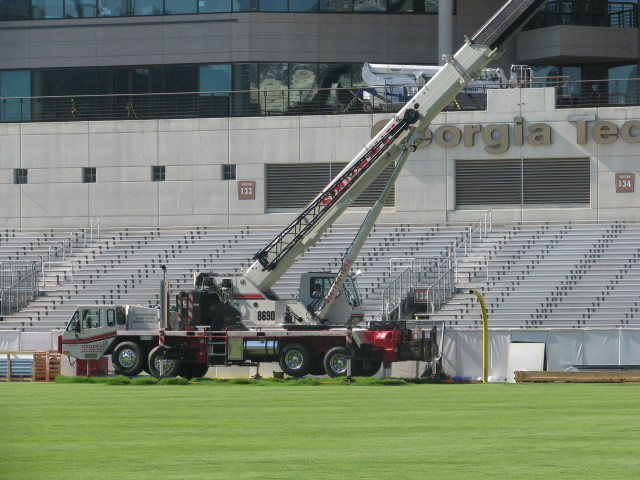 Workers putting up video board
