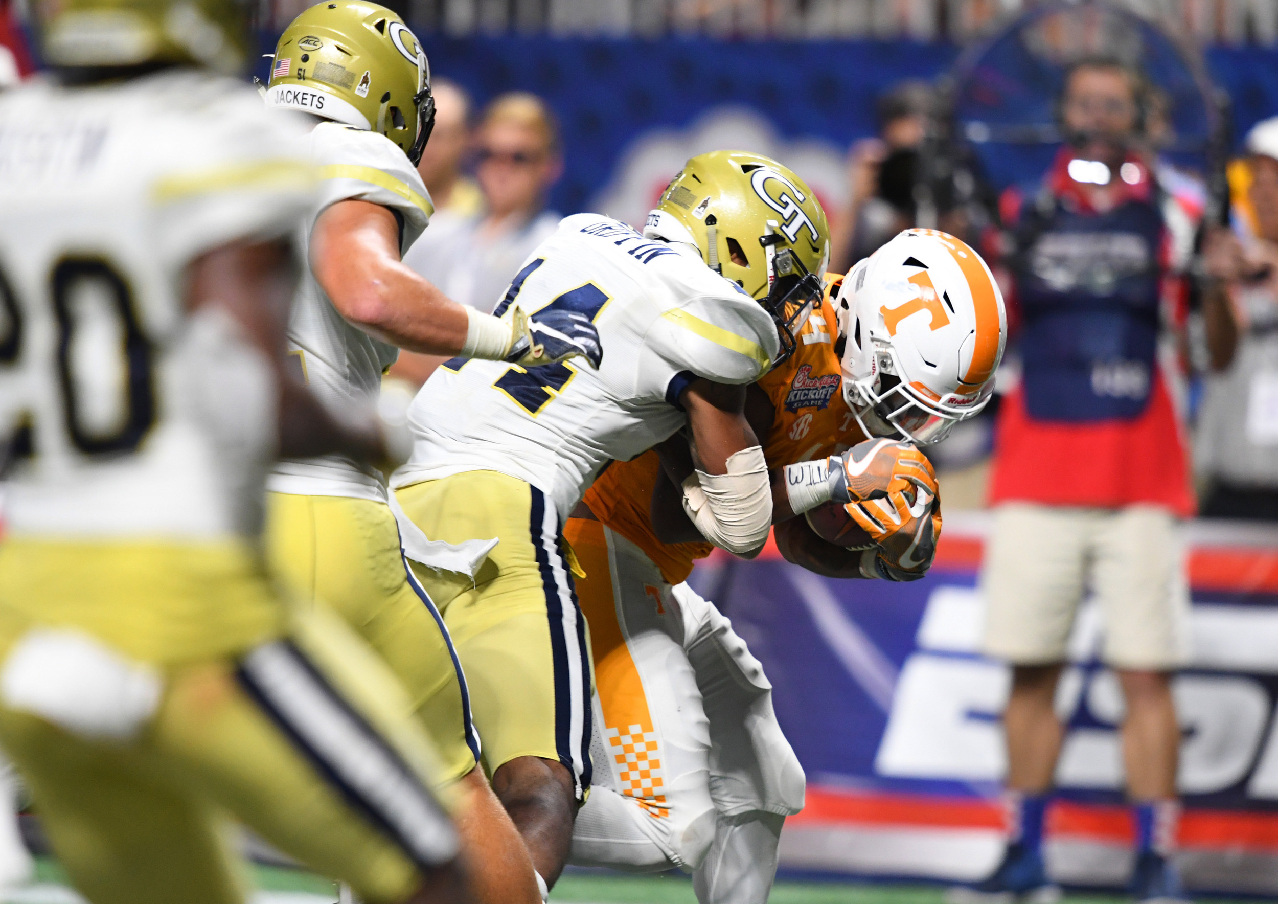 Sep 4, 2017; Atlanta, GA, USA; Tennessee Volunteers running back John Kelly (4) scores a touchdown agains Georgia Tech Yellow Jackets defensive back Corey Griffin (14) during the fourth quarter at Mercedes-Benz Stadium. Mandatory Credit: John David Mercer-USA TODAY Sports