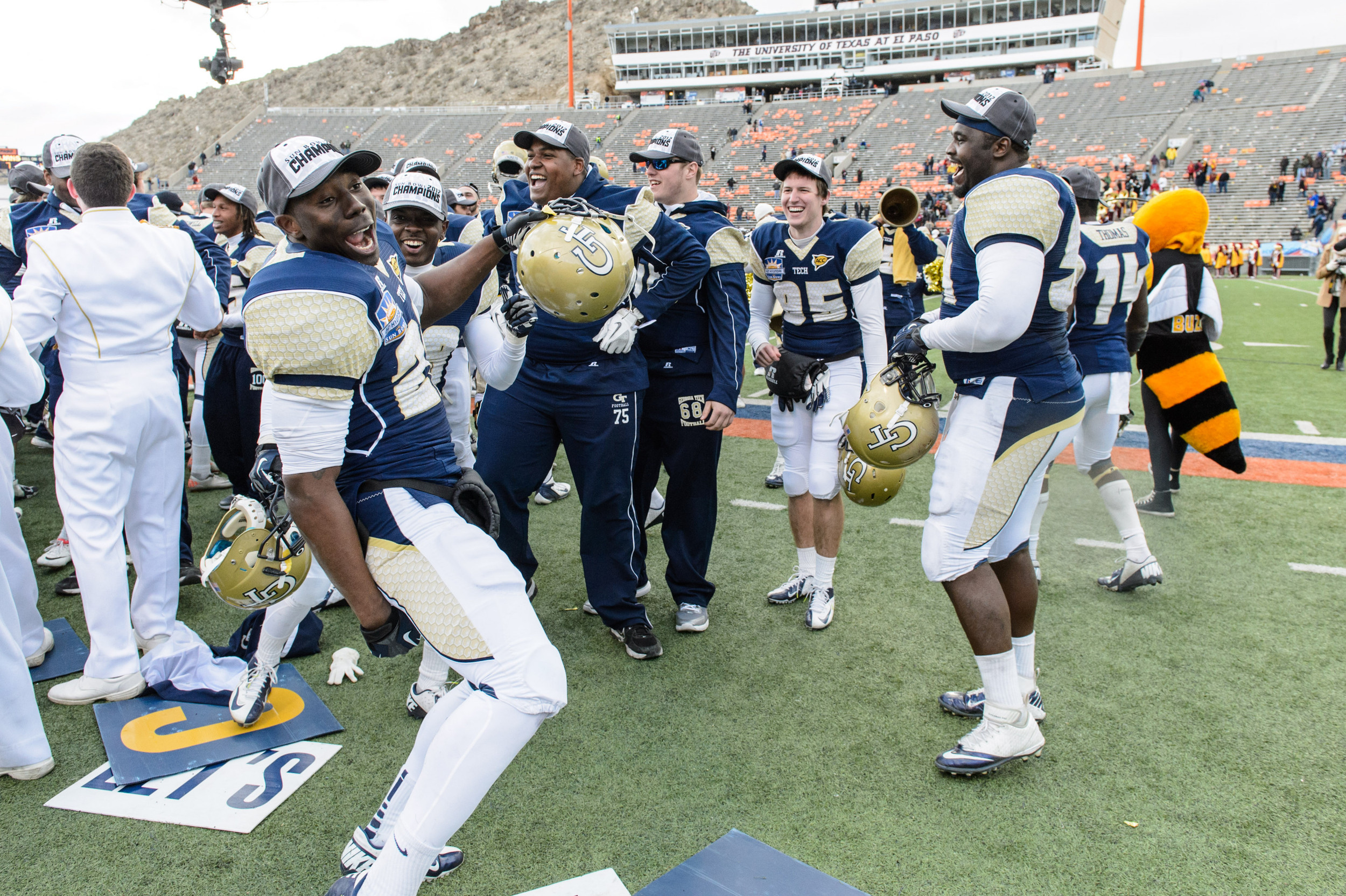 Georgia Tech players sing the Ramblin' Wreck with fans after the victory.