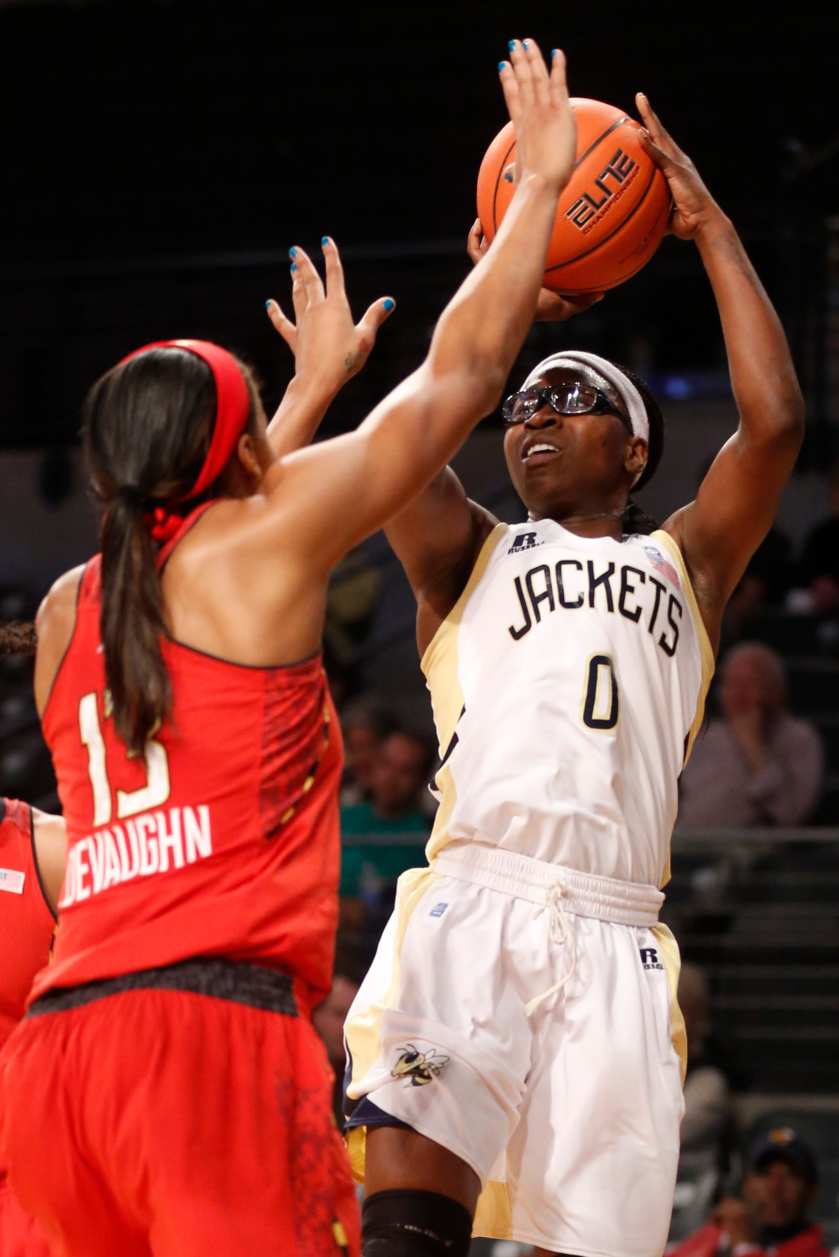 Georgia Tech guard Brittany Jackson (0) shoots over Maryland center Alicia DeVaughn (13) during the first half. (AP Photo/Josh D. Weiss)