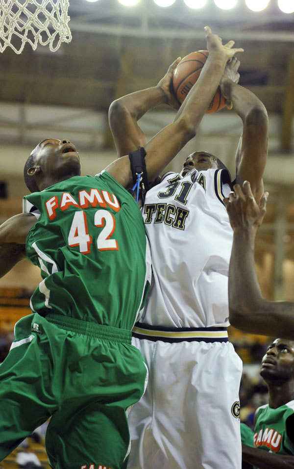 Florida A&M forward Yannick Crowder (42) blocks a shot by Georgia Tech forward Gani Lawal (31) during the first half.