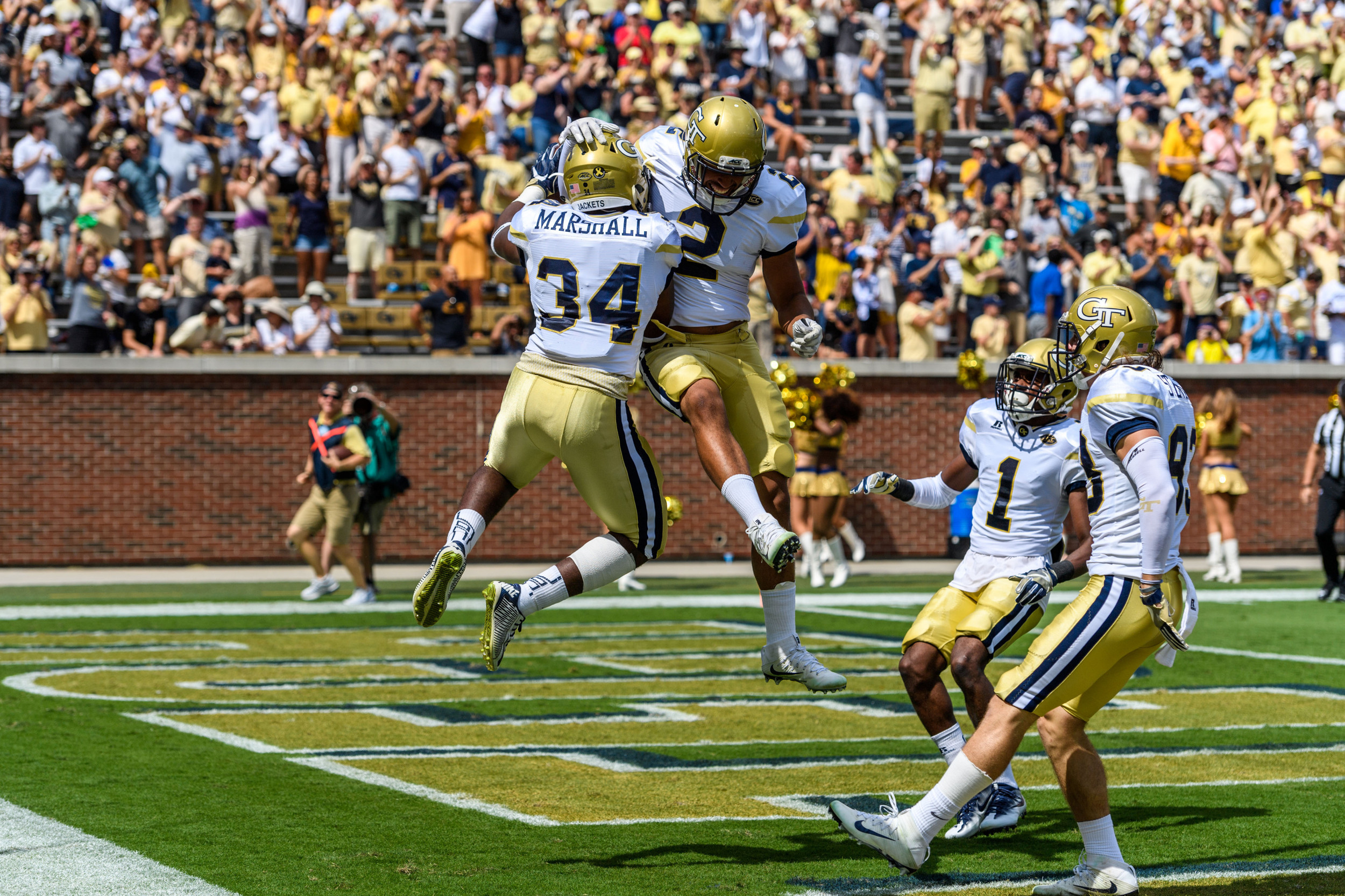 Marcus Marshall (34), Ricky Jeune (2) celebrate touchdown to open the game versus Vanderbilt.