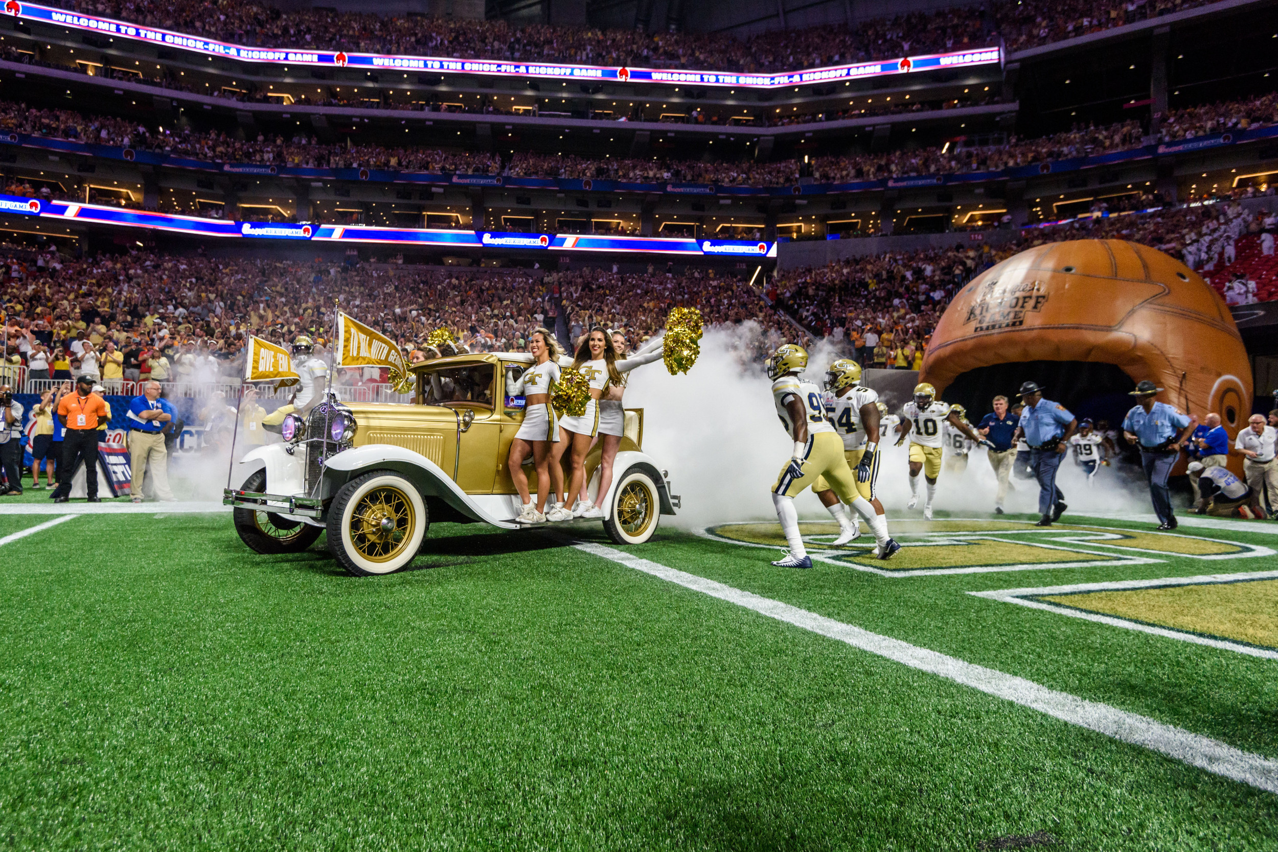 The Ramblin' Reck leads the team out of the tunnel